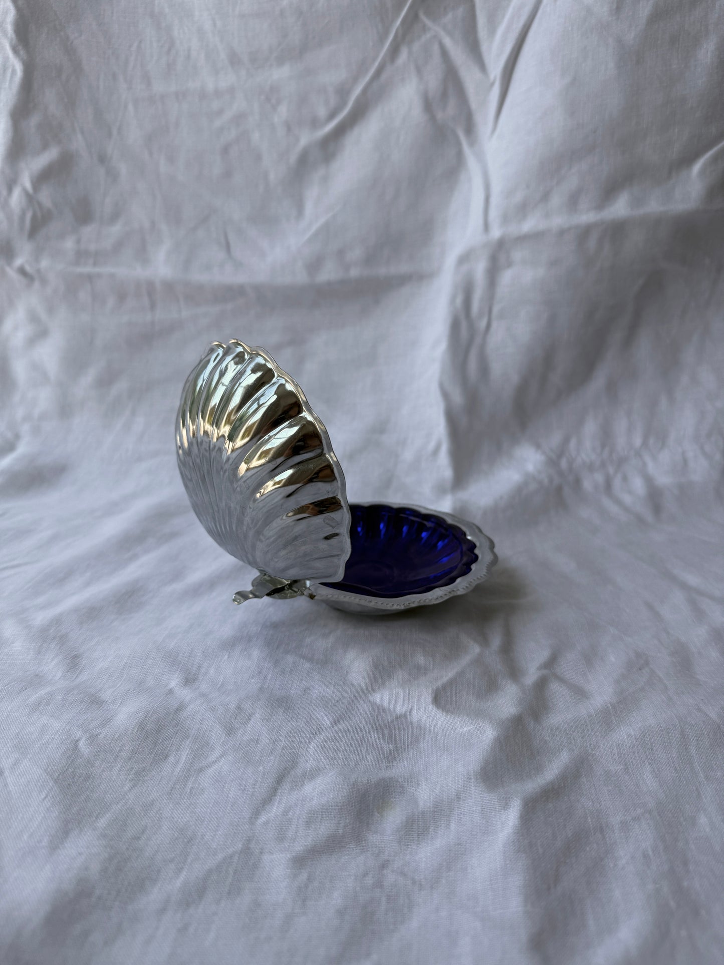 Silver plated shell caviar dish with cobalt blue glass insert