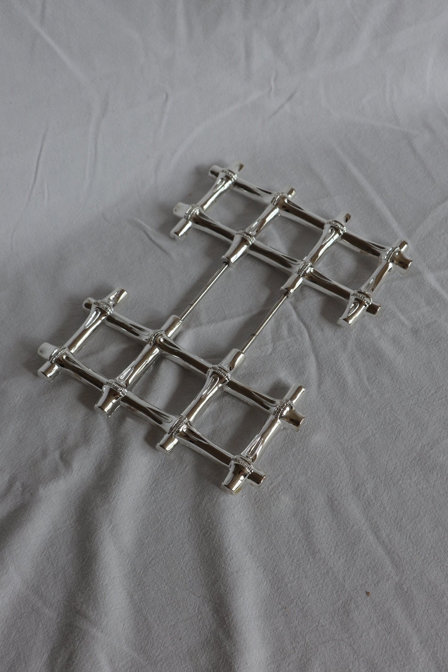 Expanding vintage silver faux bamboo trivet