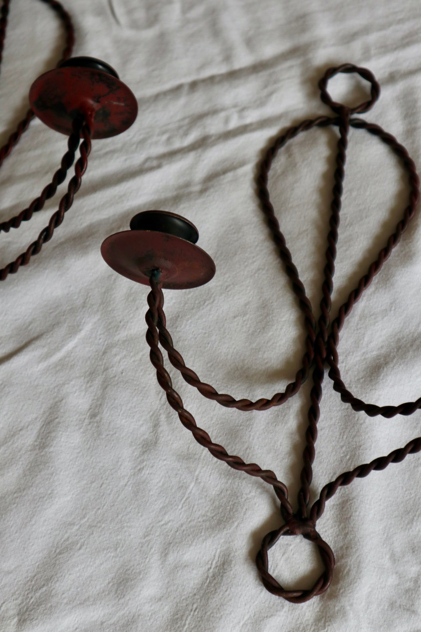 Pair of braided metal double candle sconces