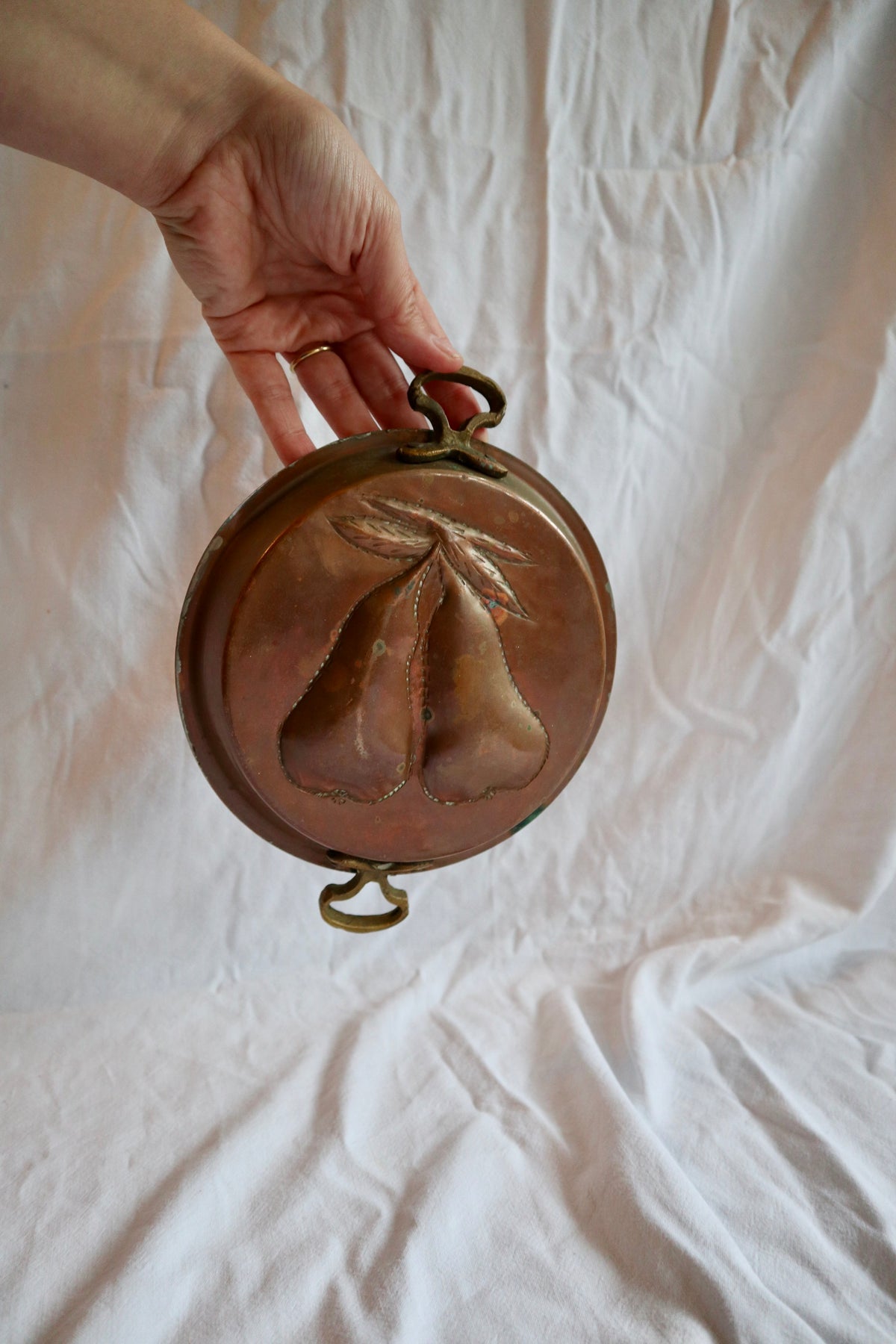 Brass and copper jelly mould with pears