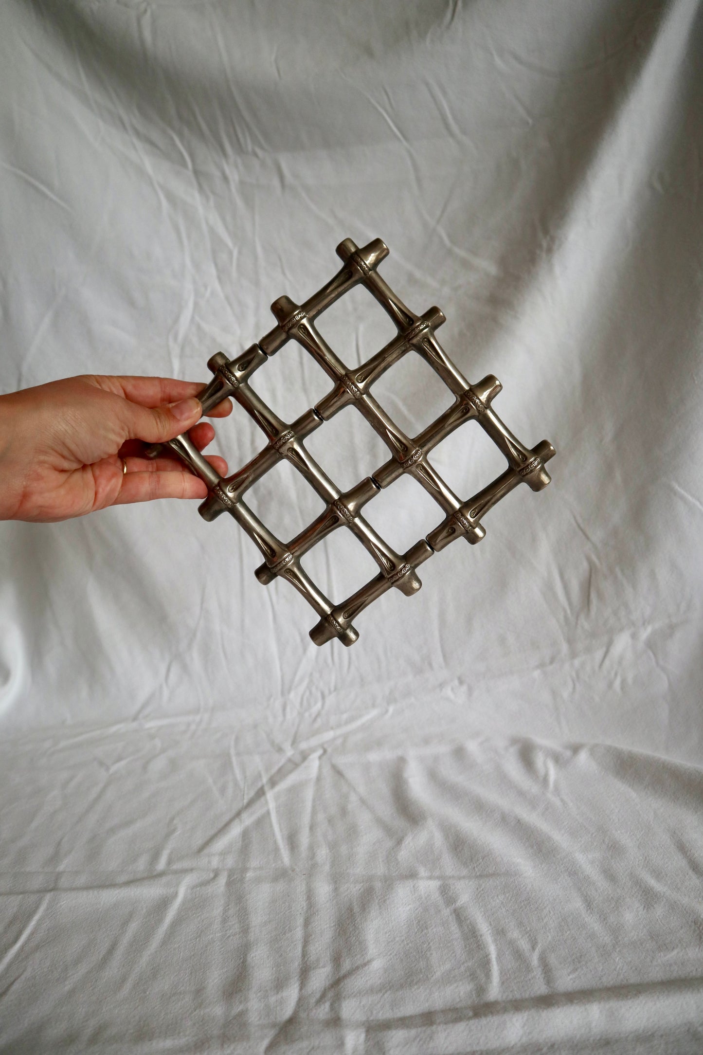 Expanding vintage silver faux bamboo trivet