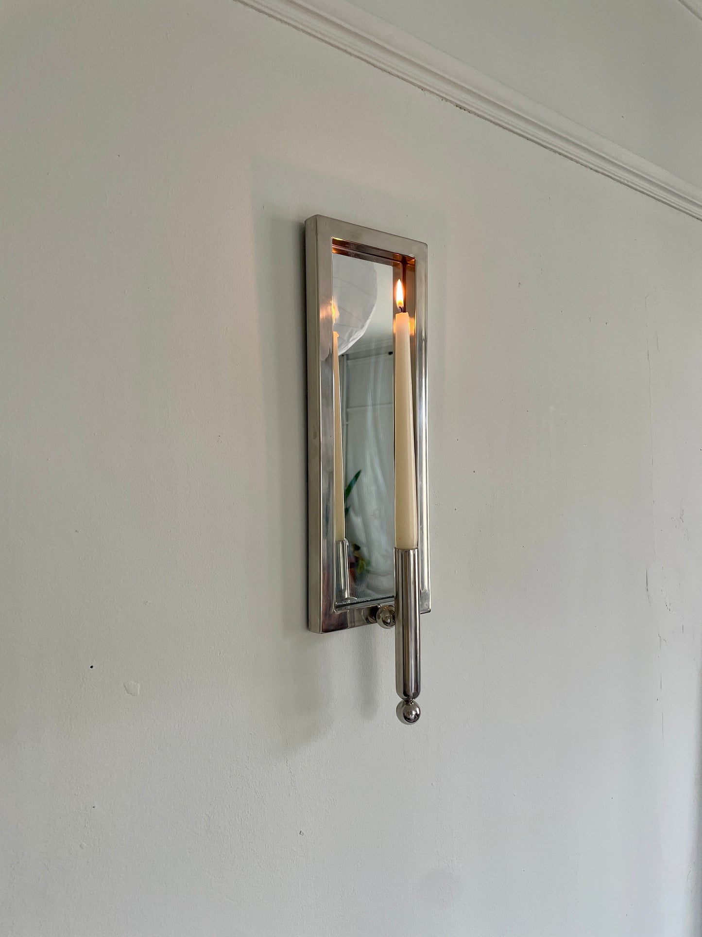 Chrome and mirrored sconce