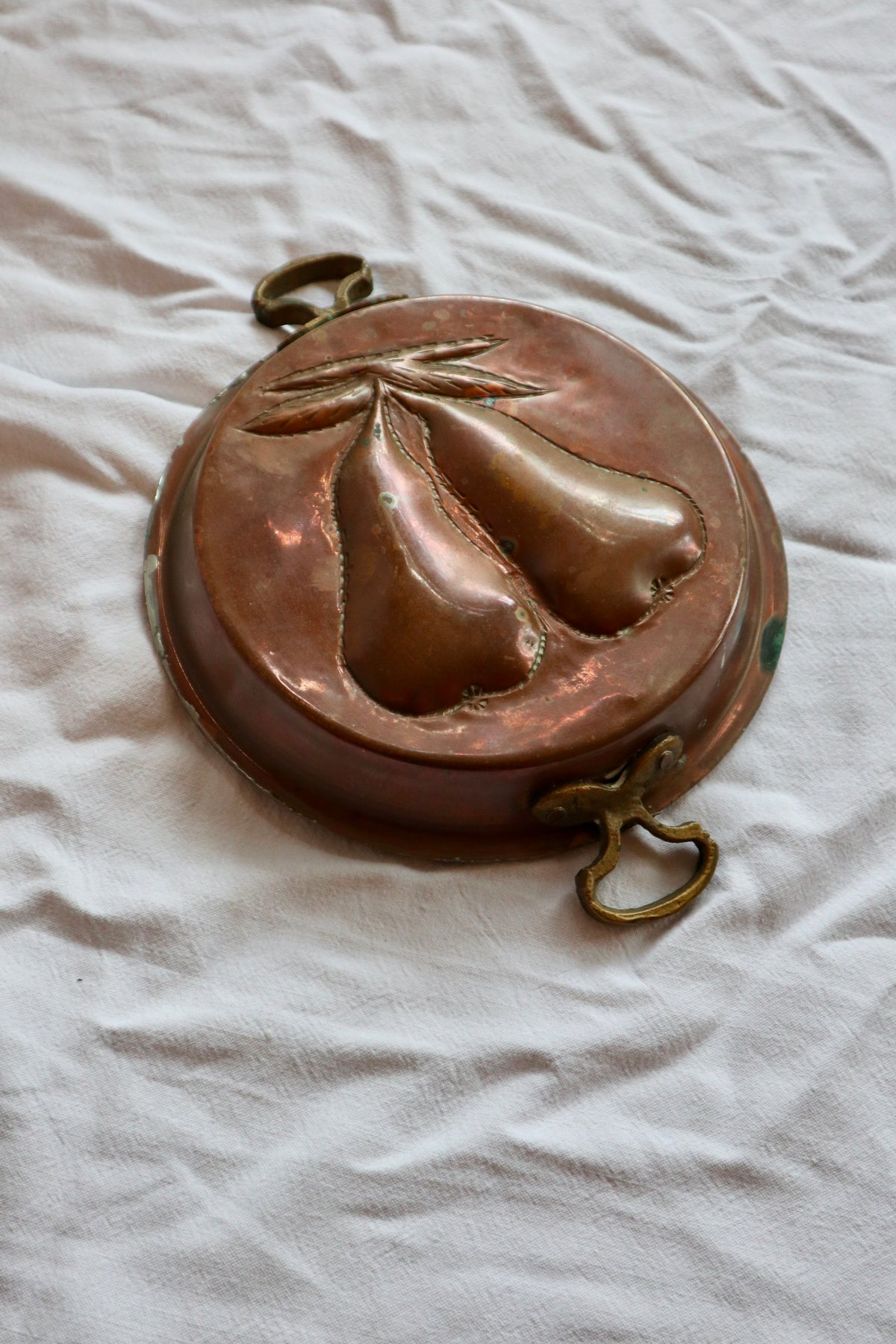 Brass and copper jelly mould with pears