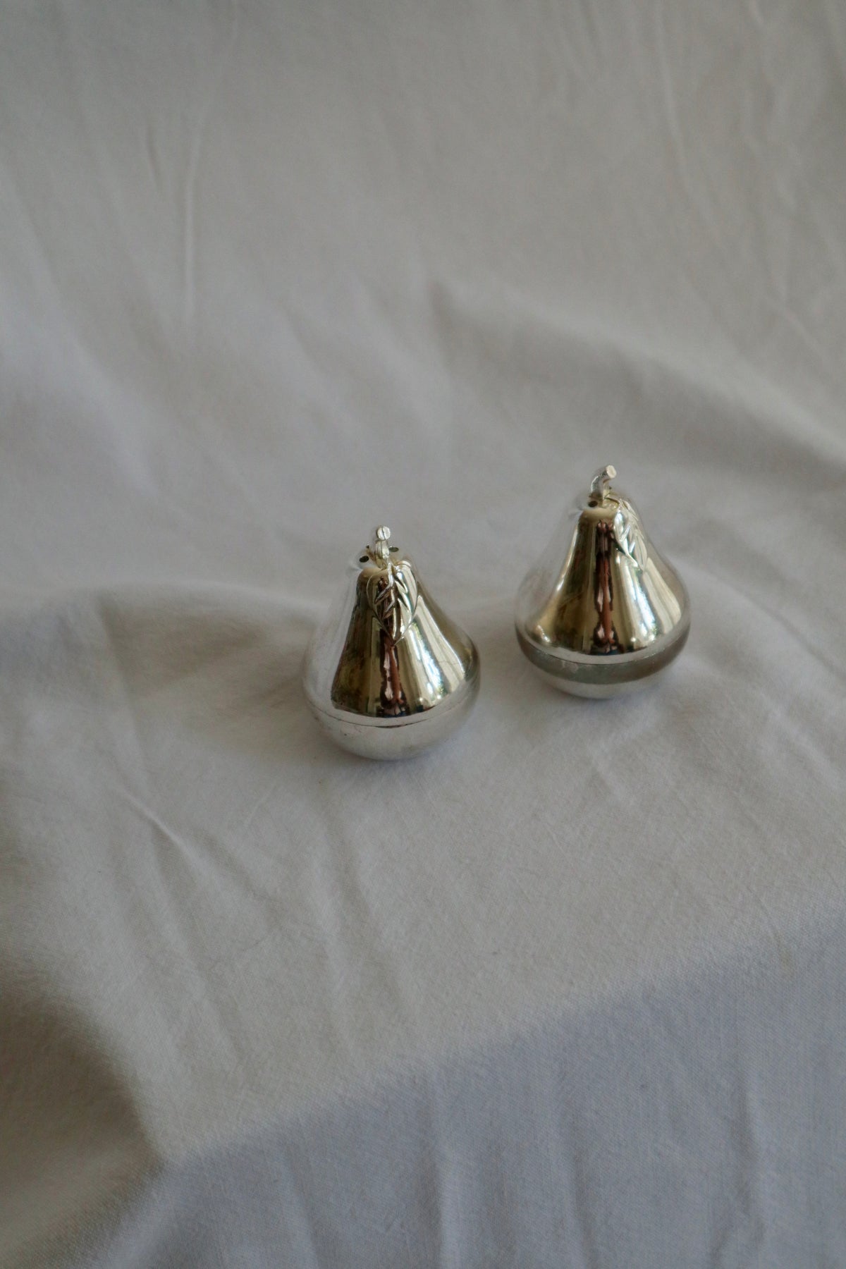 Pair of silver plated pear-shaped salt and pepper shakers
