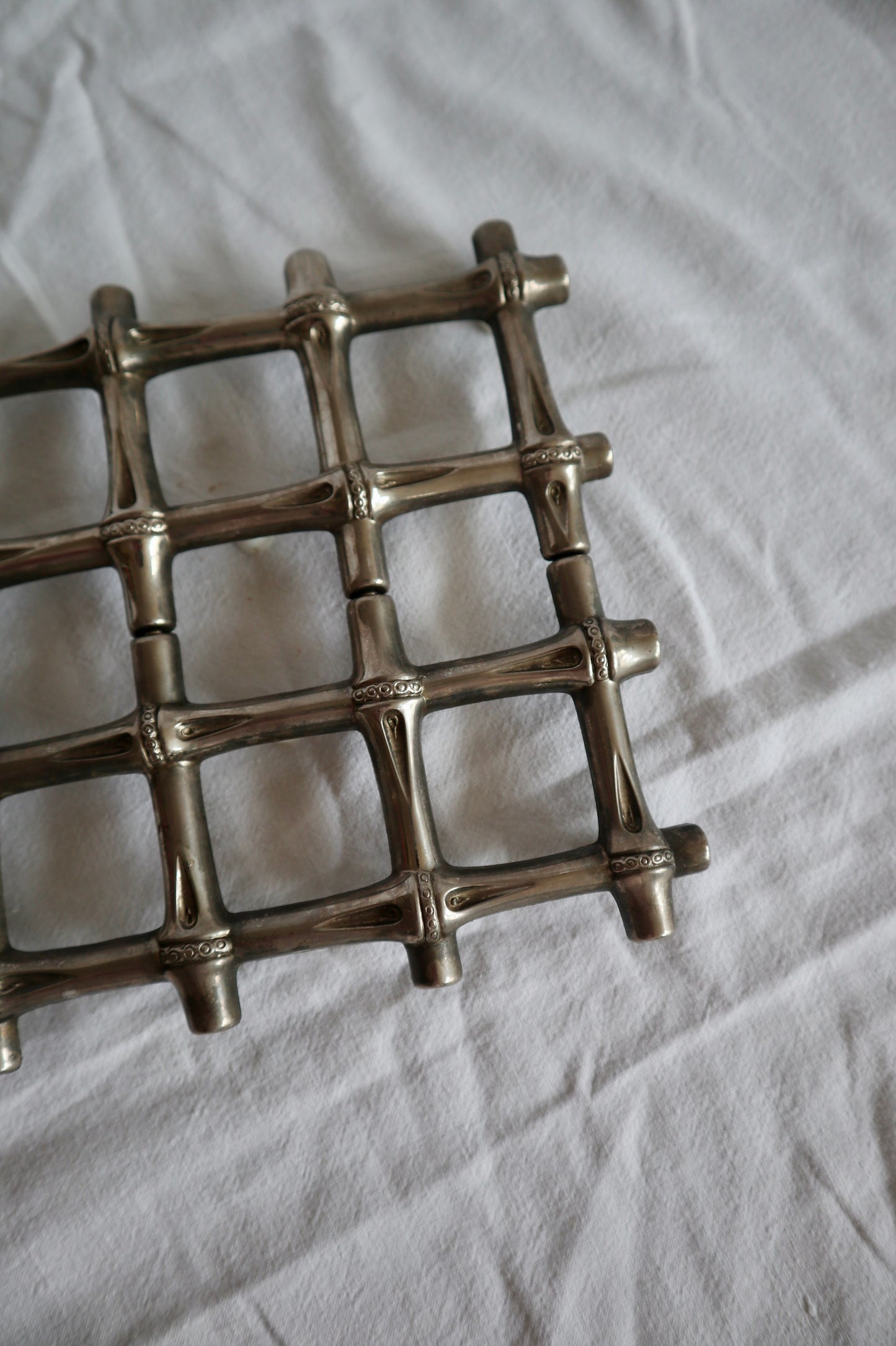 Expanding vintage silver faux bamboo trivet