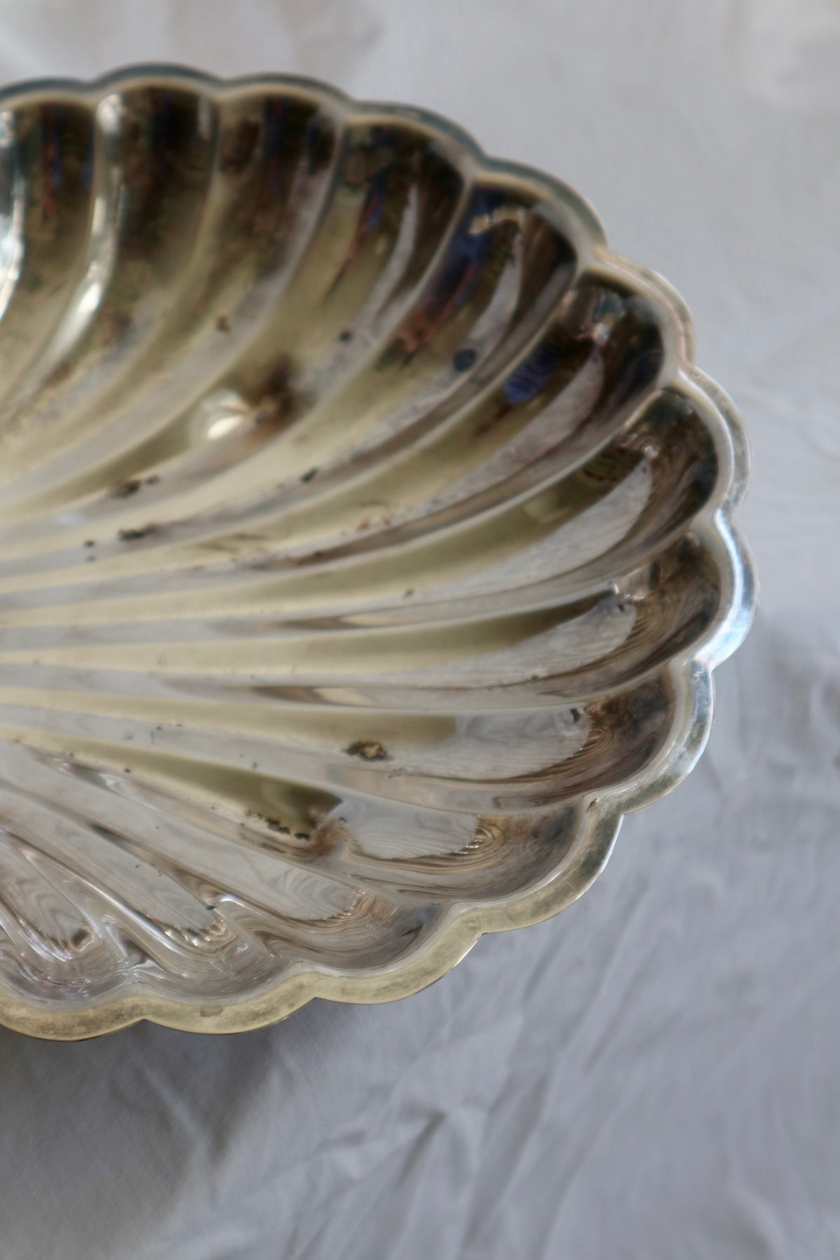 Large silver shell serving platter with candleholder