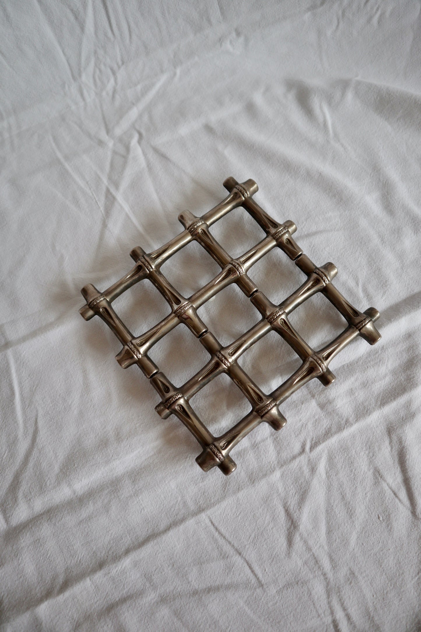 Expanding vintage silver faux bamboo trivet