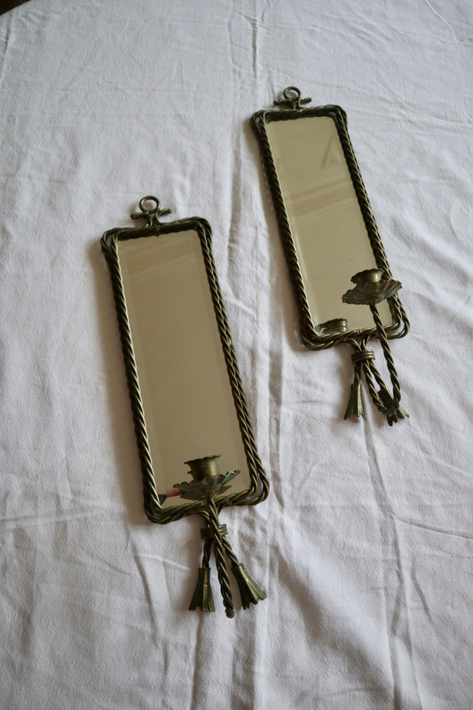 Pair of ornate braided metal and tassel mirror sconces