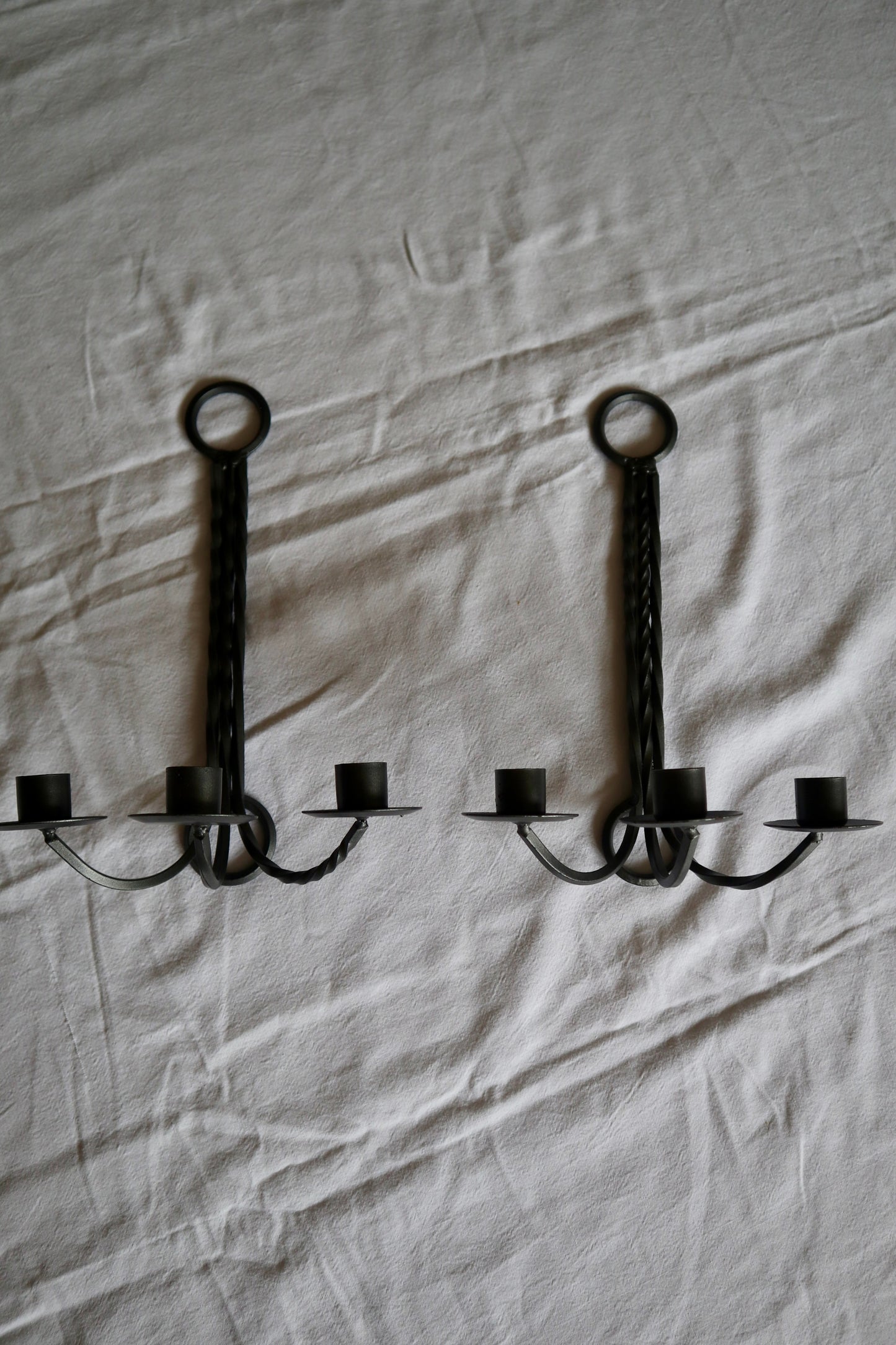 Pair of vintage wrought iron triple candle sconces