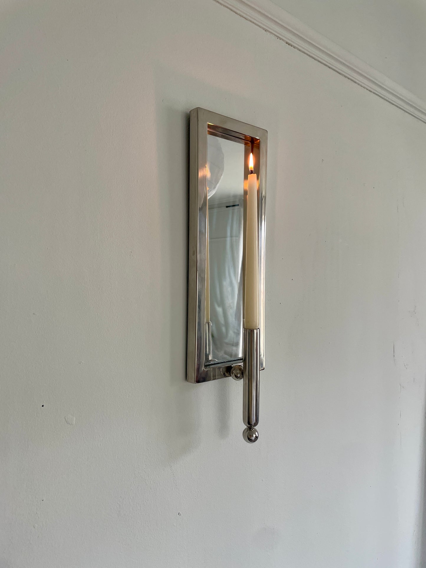 Chrome and mirrored sconce