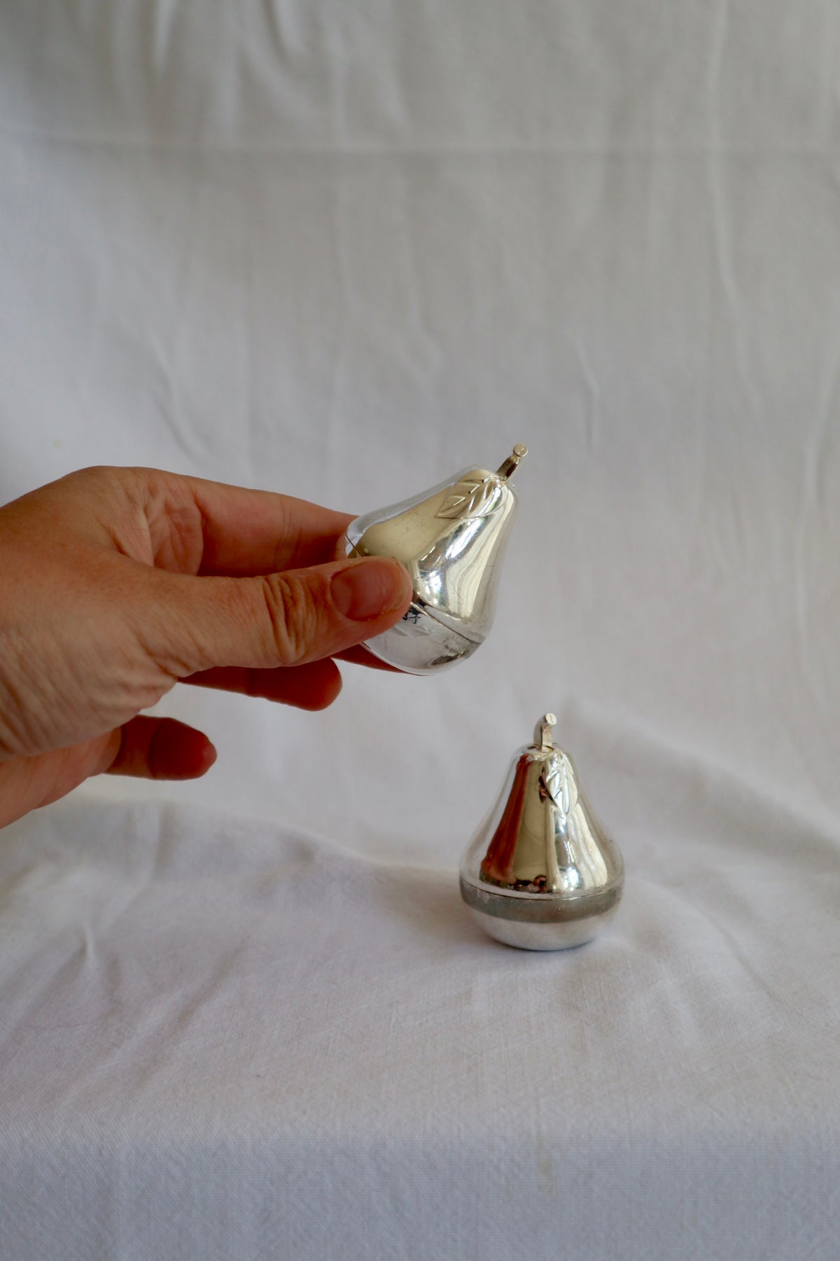 Pair of silver plated pear-shaped salt and pepper shakers