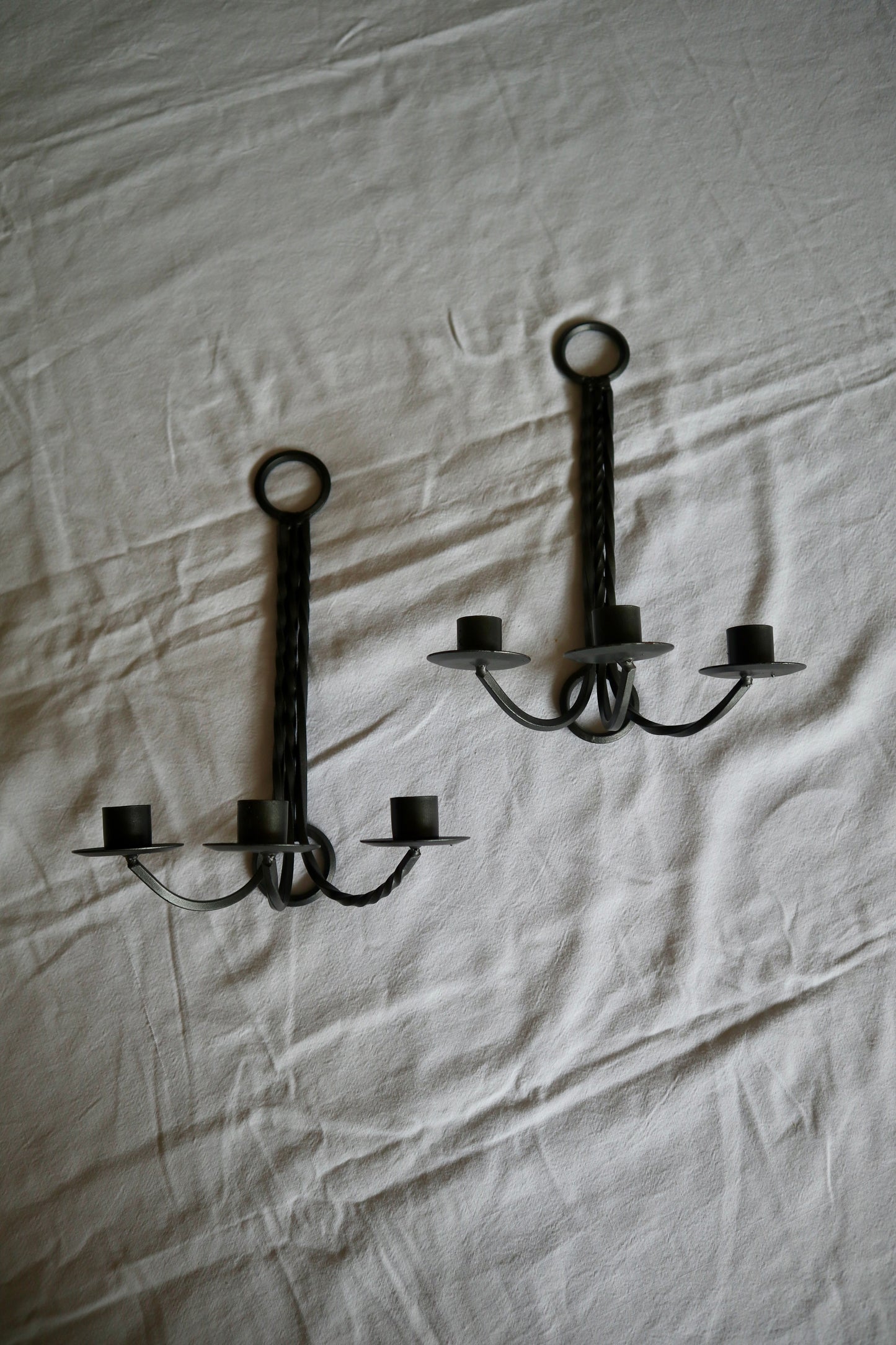 Pair of vintage wrought iron triple candle sconces