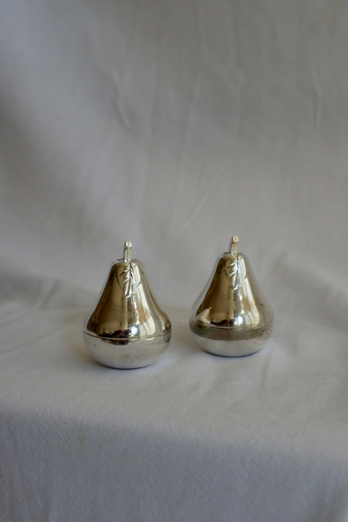 Pair of silver plated pear-shaped salt and pepper shakers