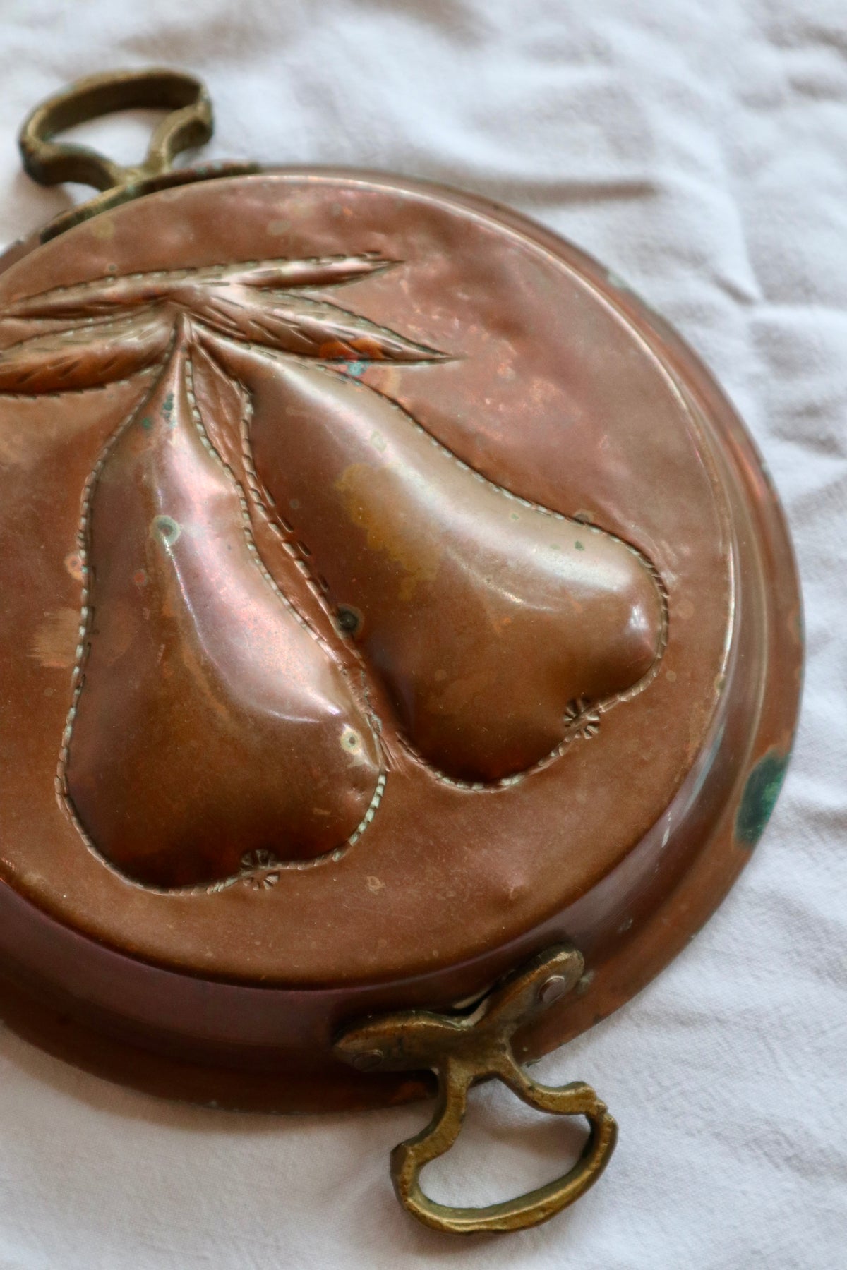 Brass and copper jelly mould with pears