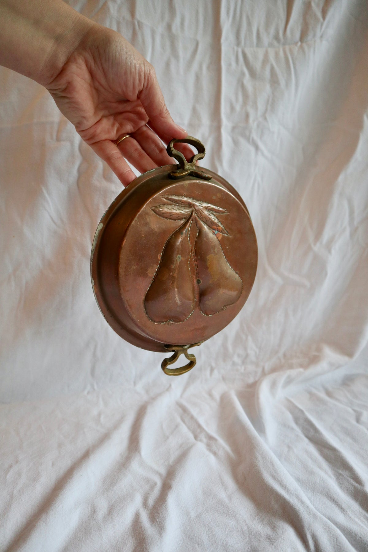 Brass and copper jelly mould with pears