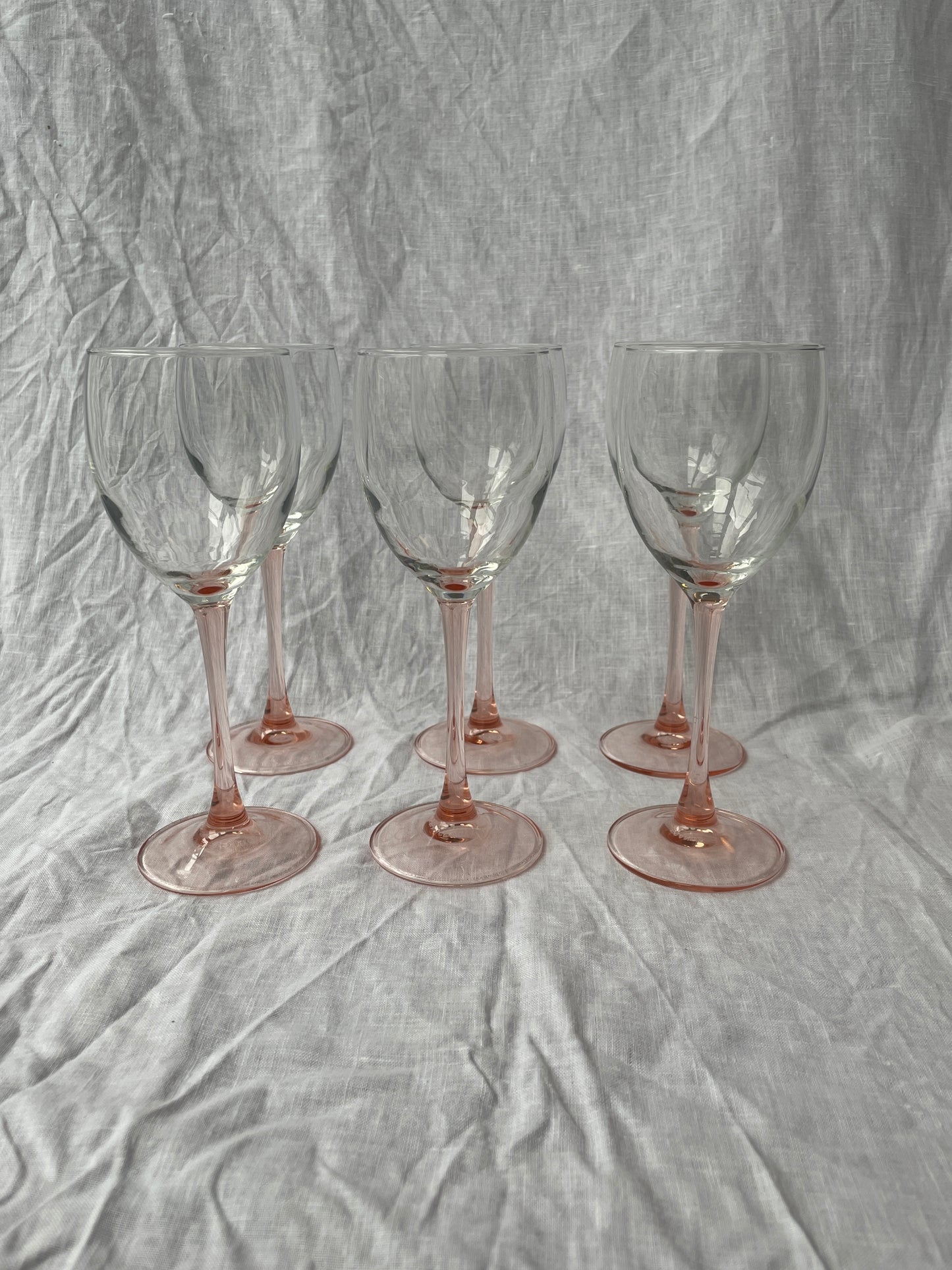 Pink stemmed wine glasses