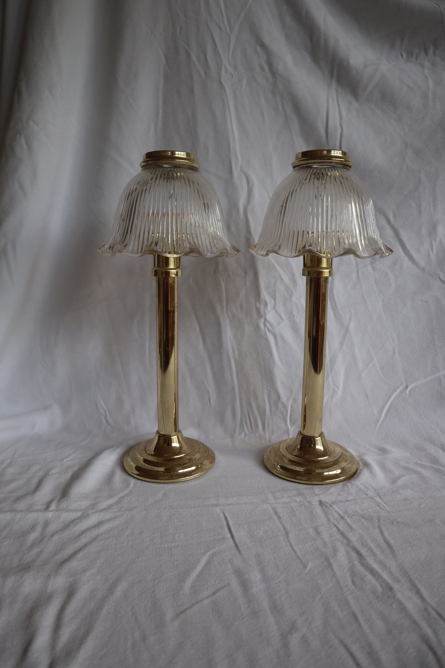 Pair of large brass-tone and ribbed glass vintage candle lamps