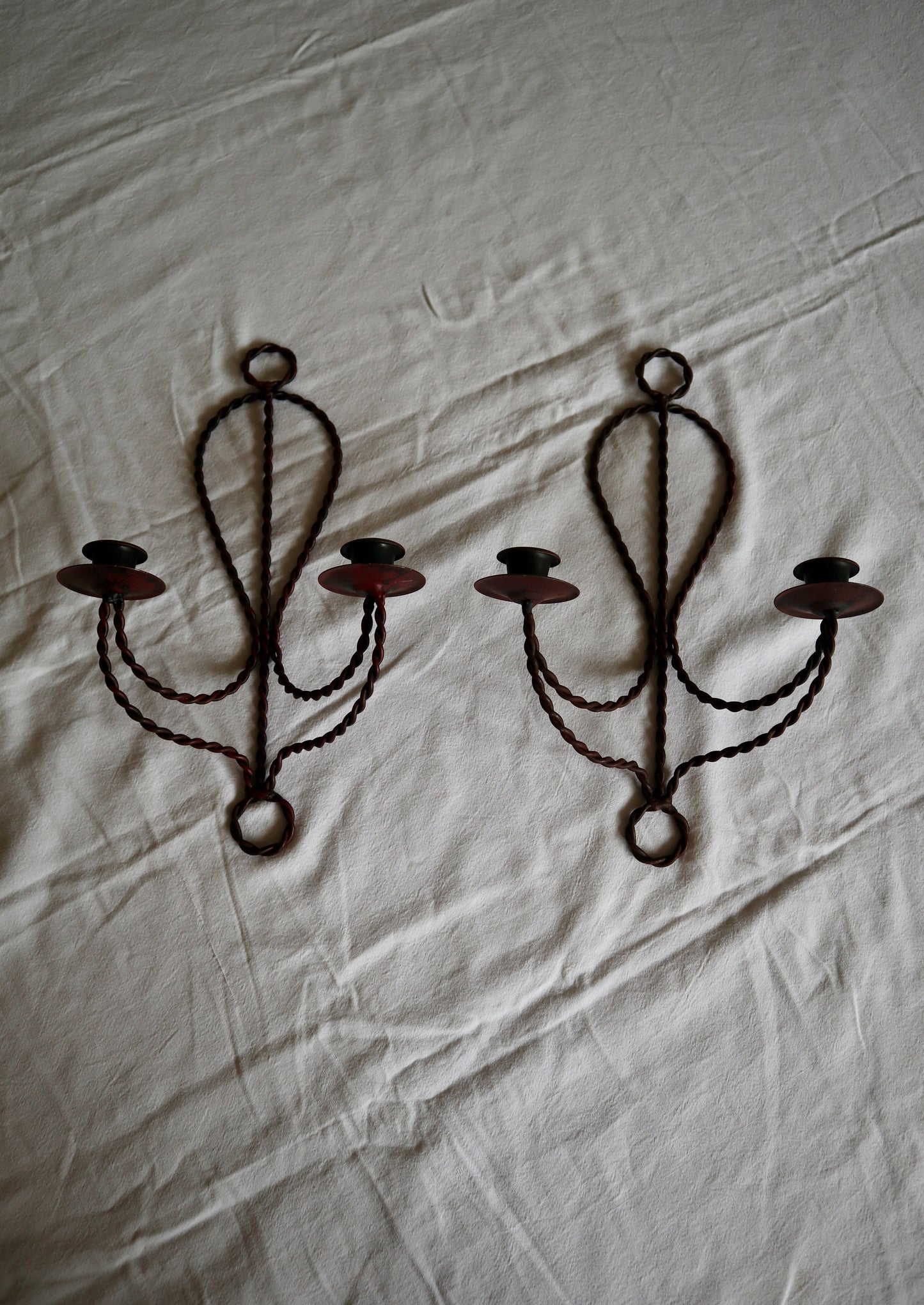 Pair of braided metal double candle sconces