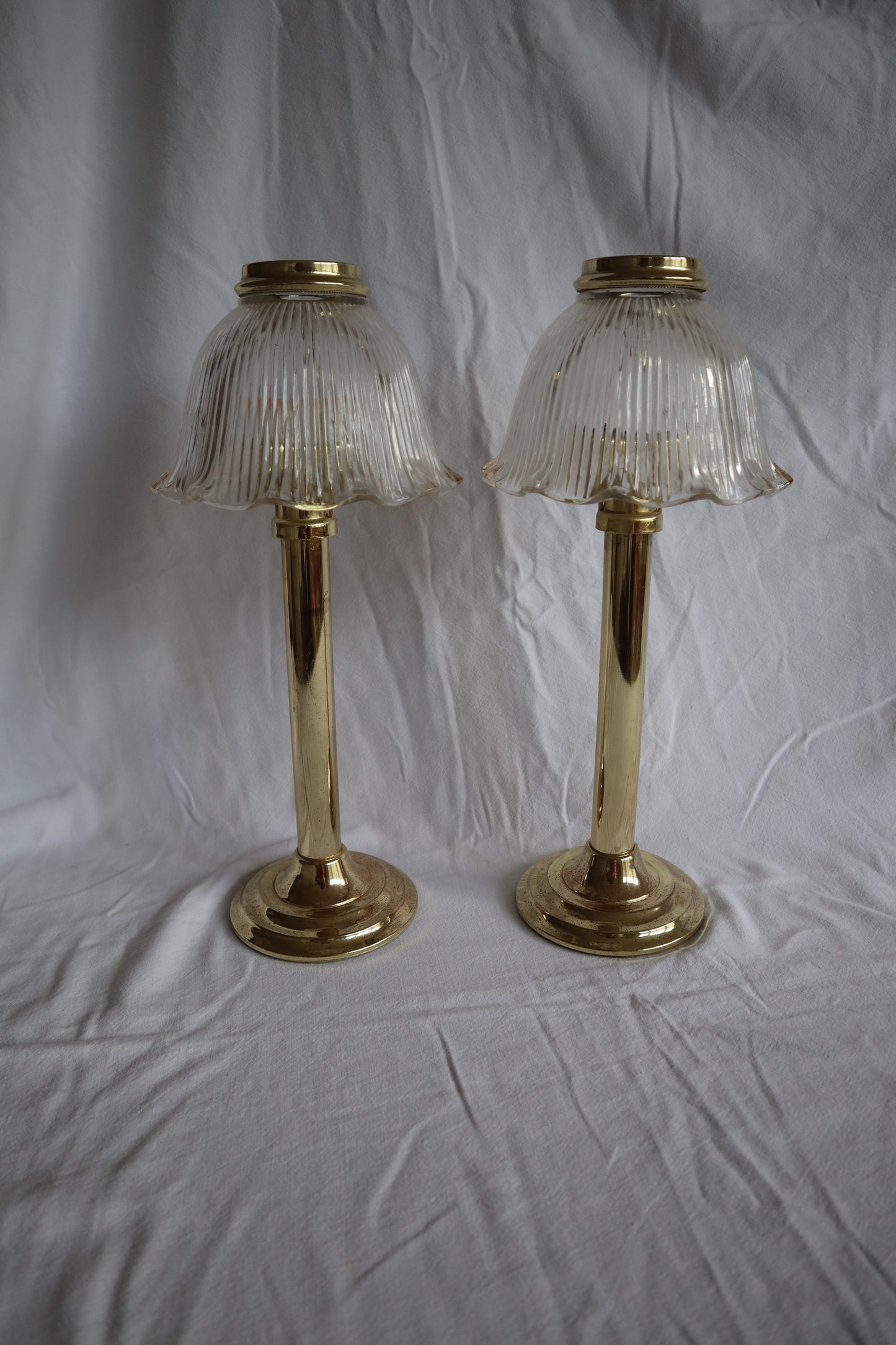 Pair of large brass-tone and ribbed glass vintage candle lamps