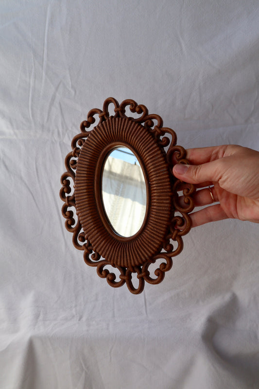 Vintage mirror with decorative wooden frame