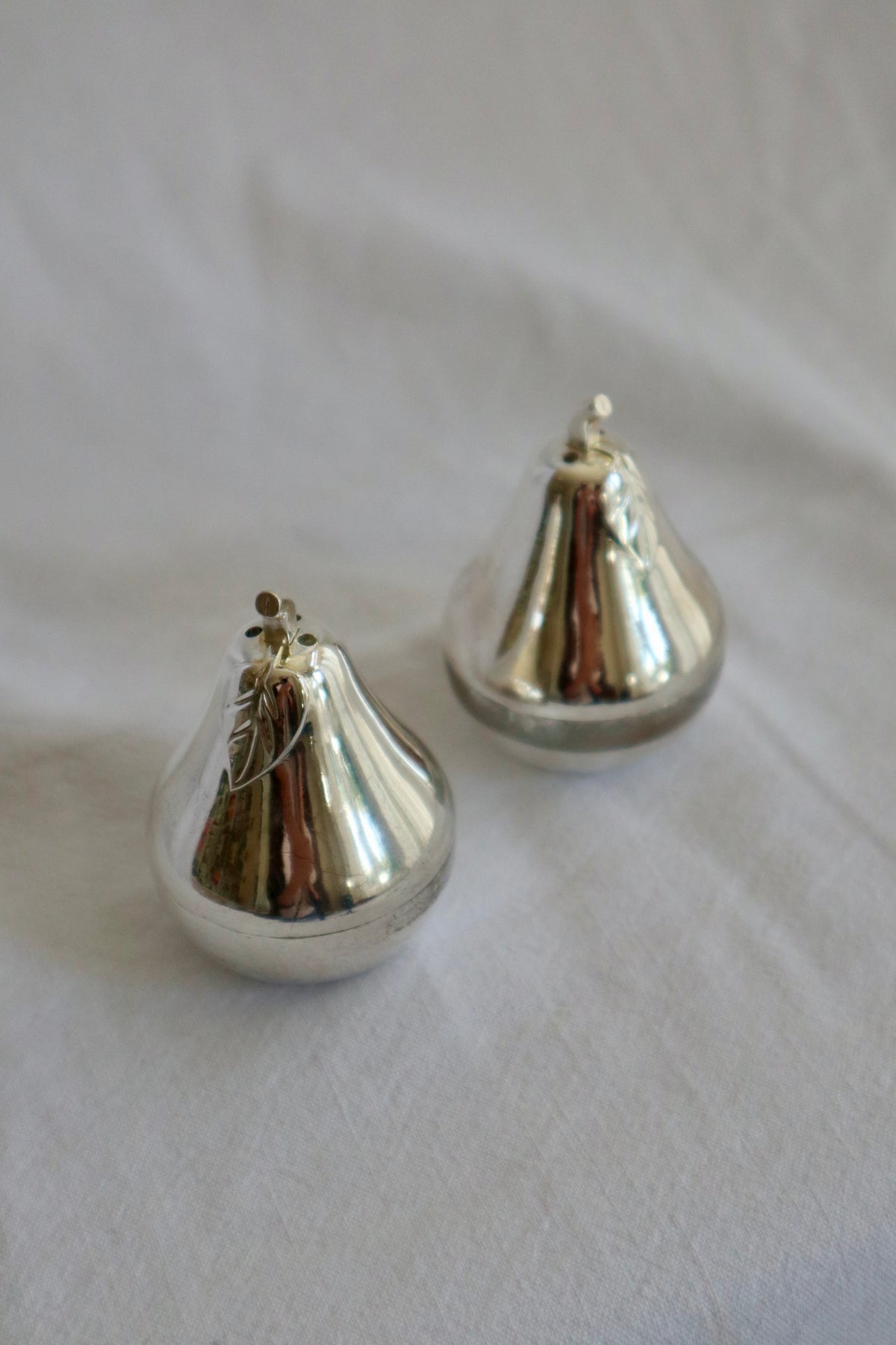 Pair of silver plated pear-shaped salt and pepper shakers