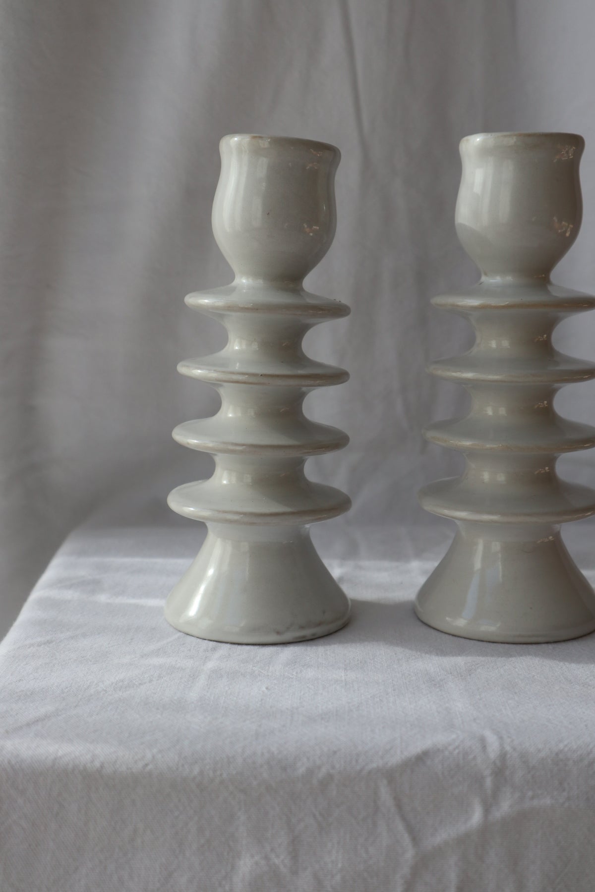 Pair of white ceramic hooped candleholders