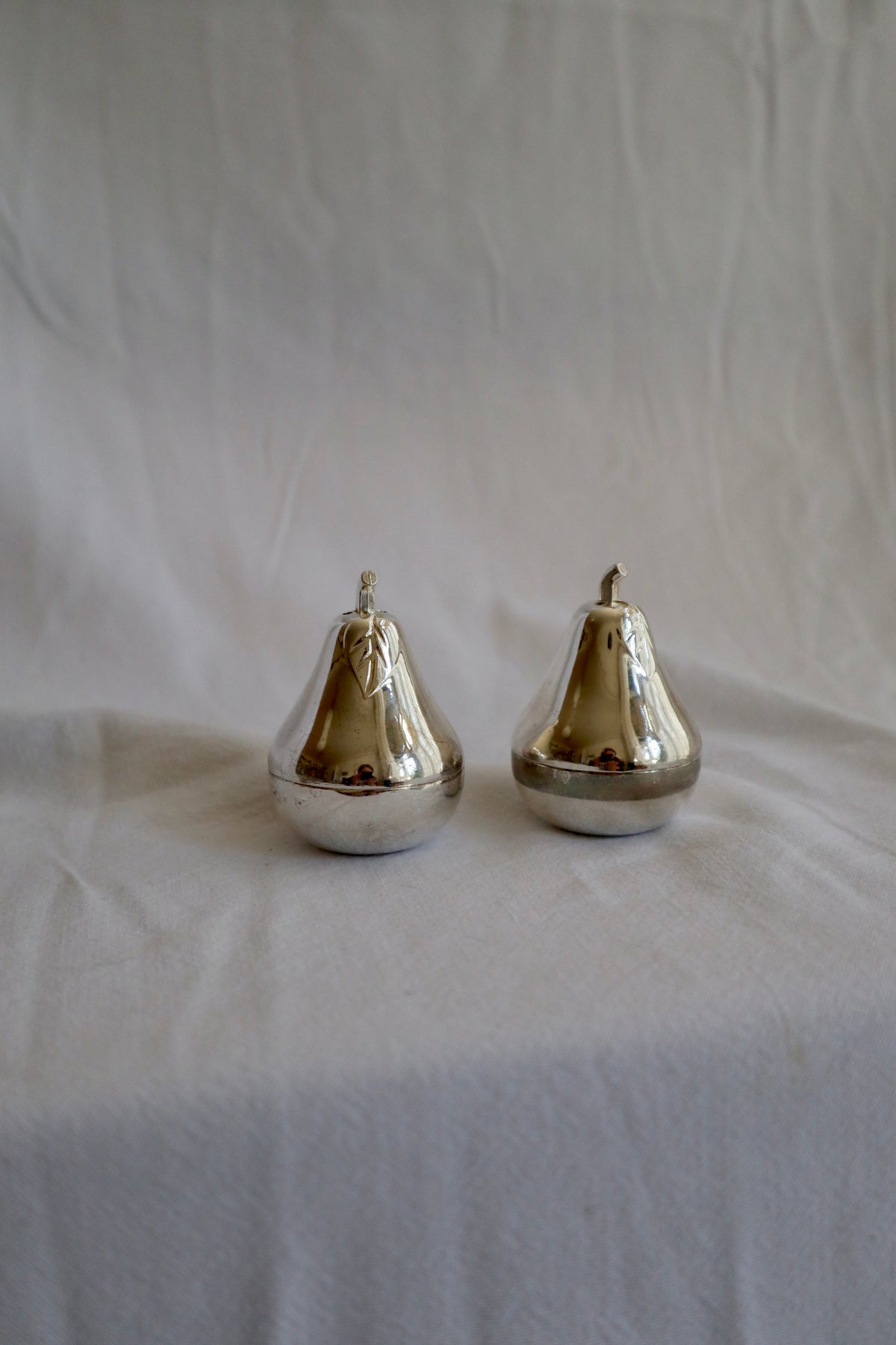Pair of silver plated pear-shaped salt and pepper shakers