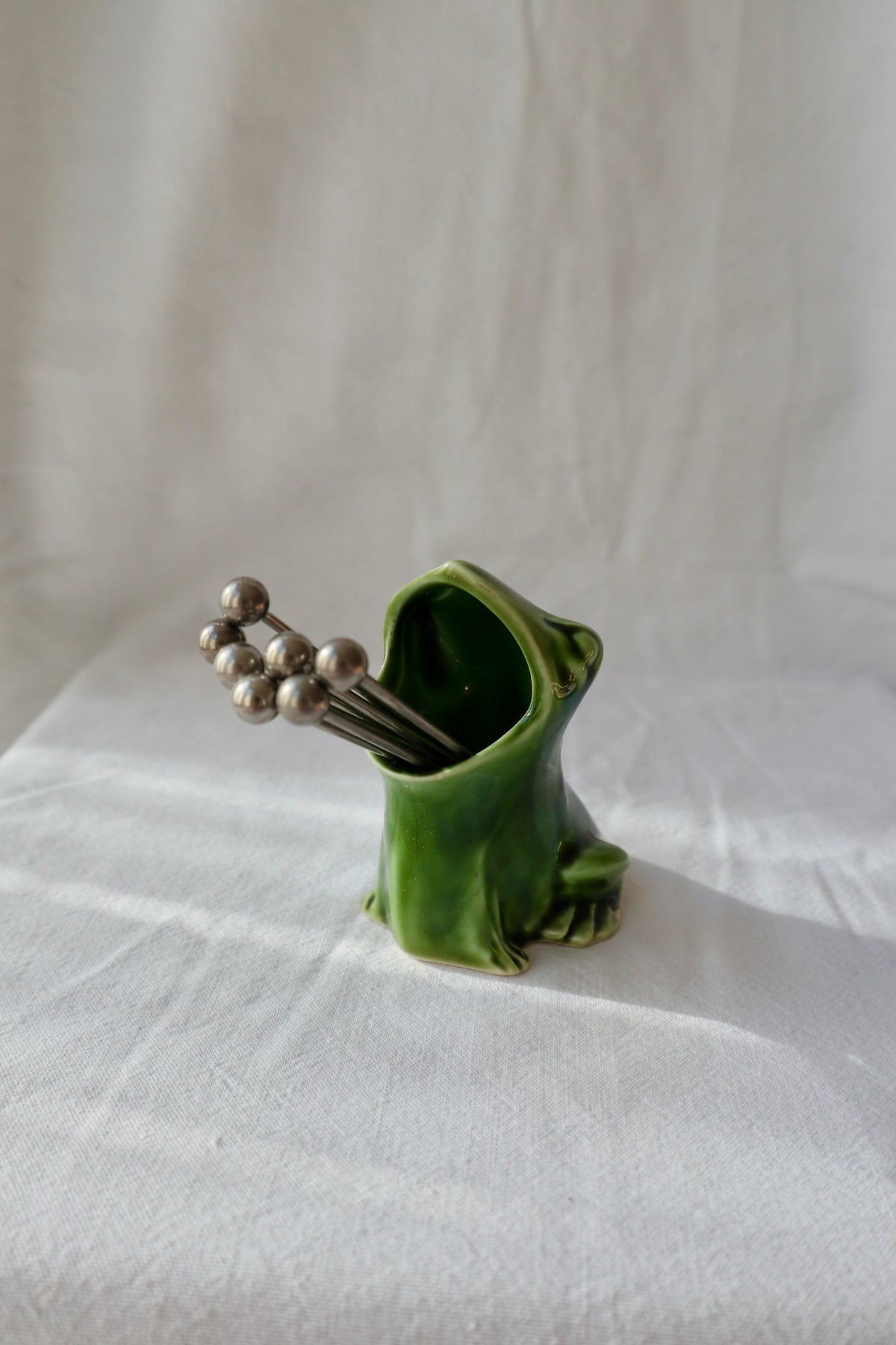 Perrier green ceramic frog matchstick or cocktail stick holder