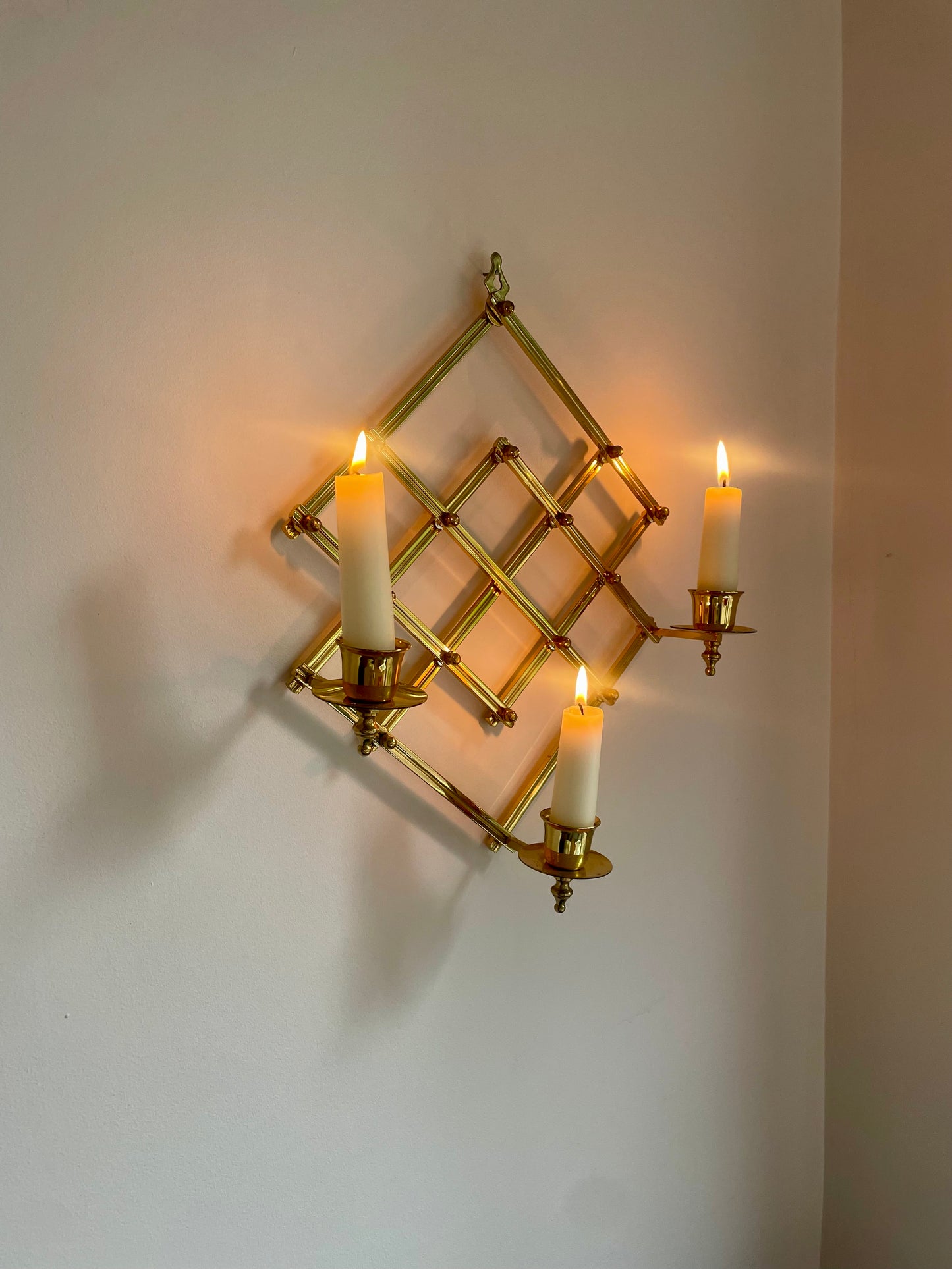 Brass accordion sconce