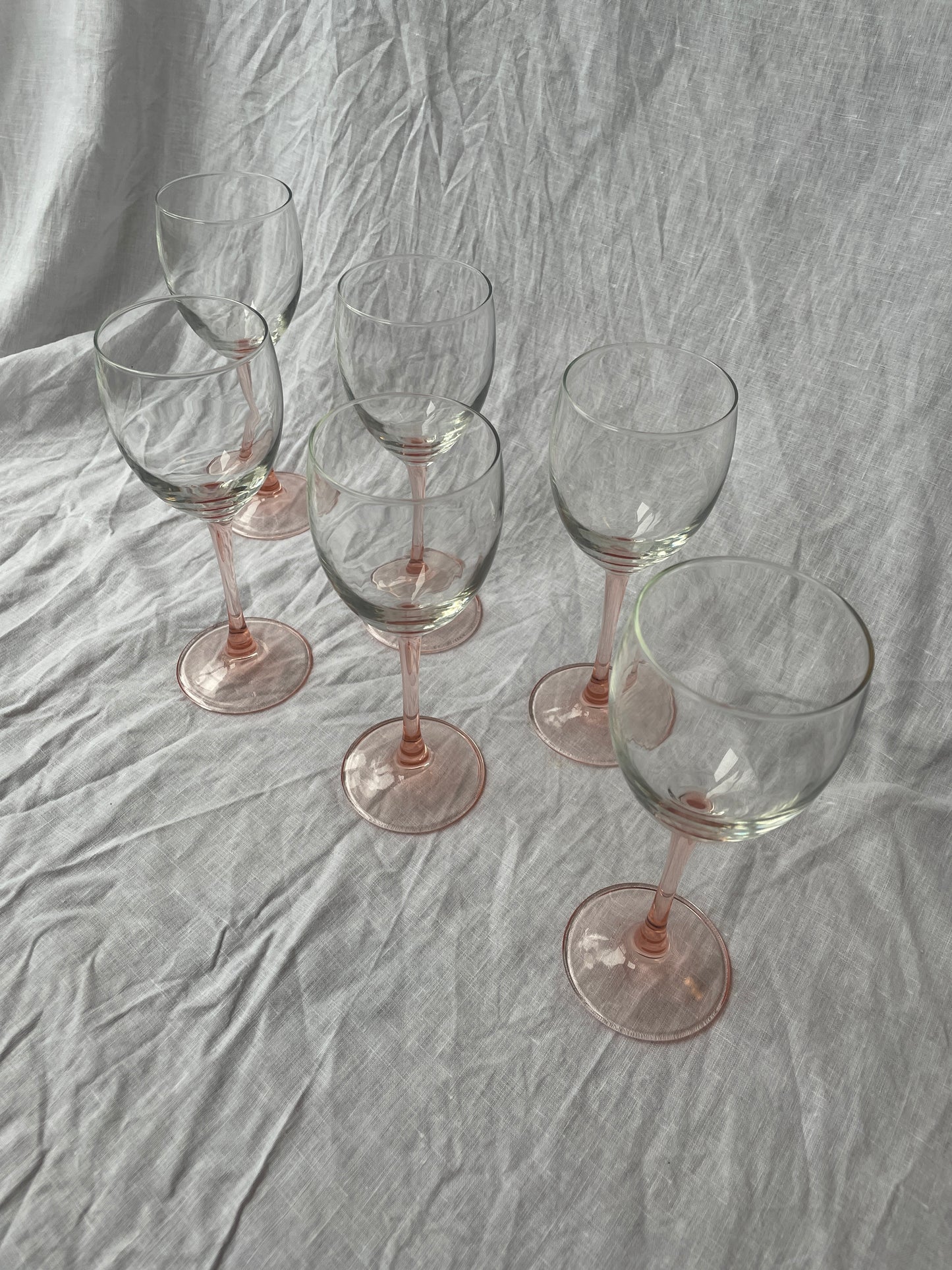 Pink stemmed wine glasses