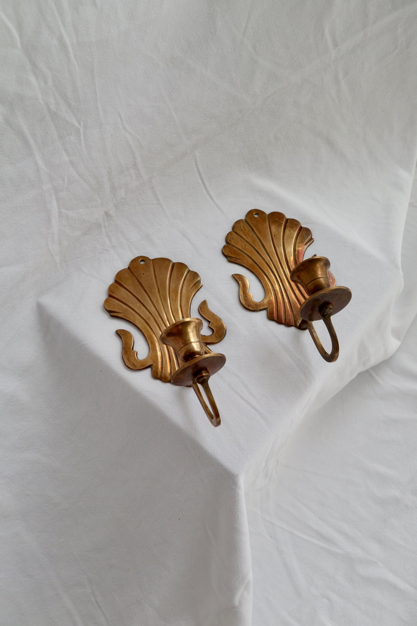 Pair of solid brass scalloped Rococo-style candle sconces
