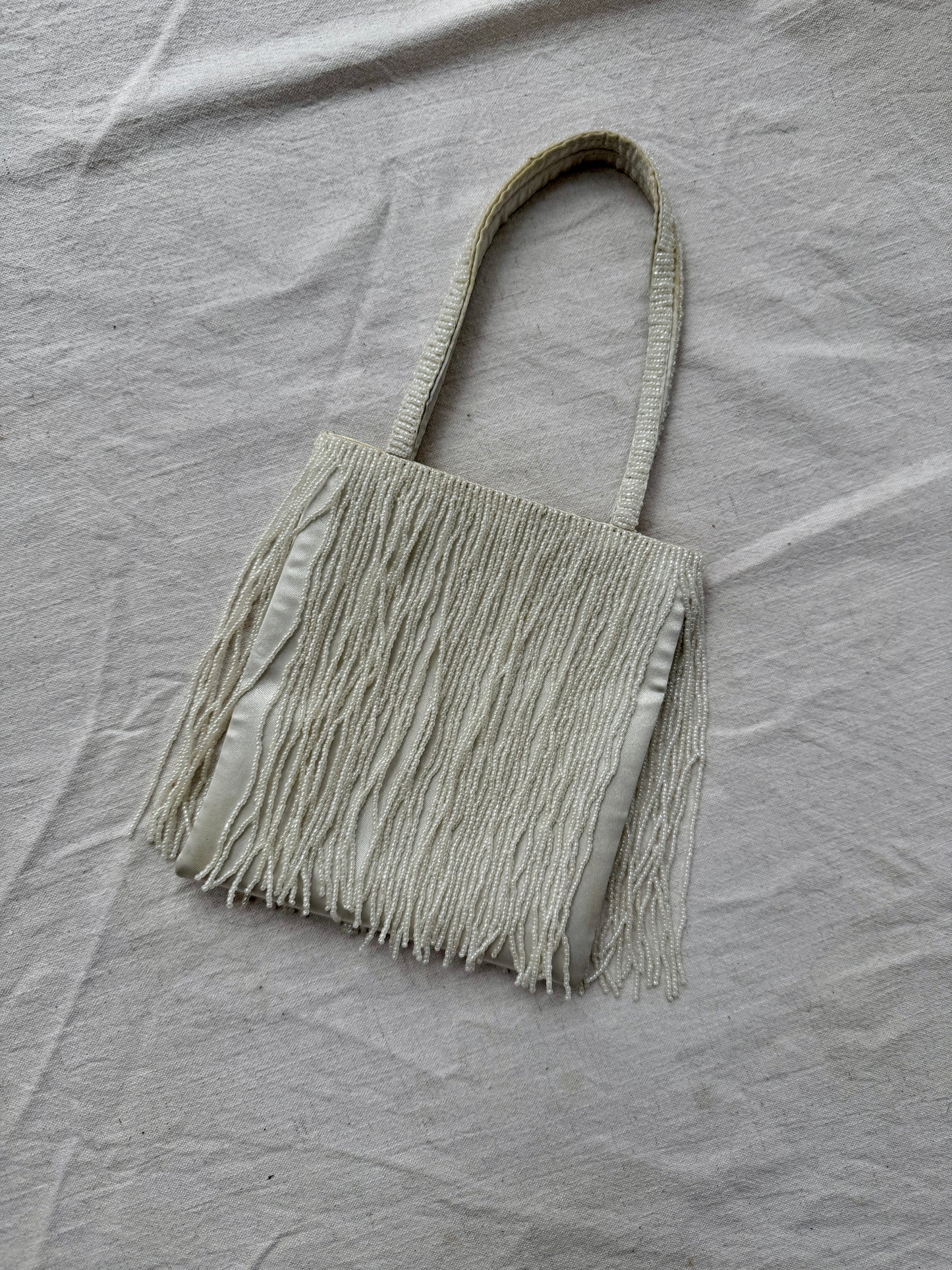 White beaded handbag