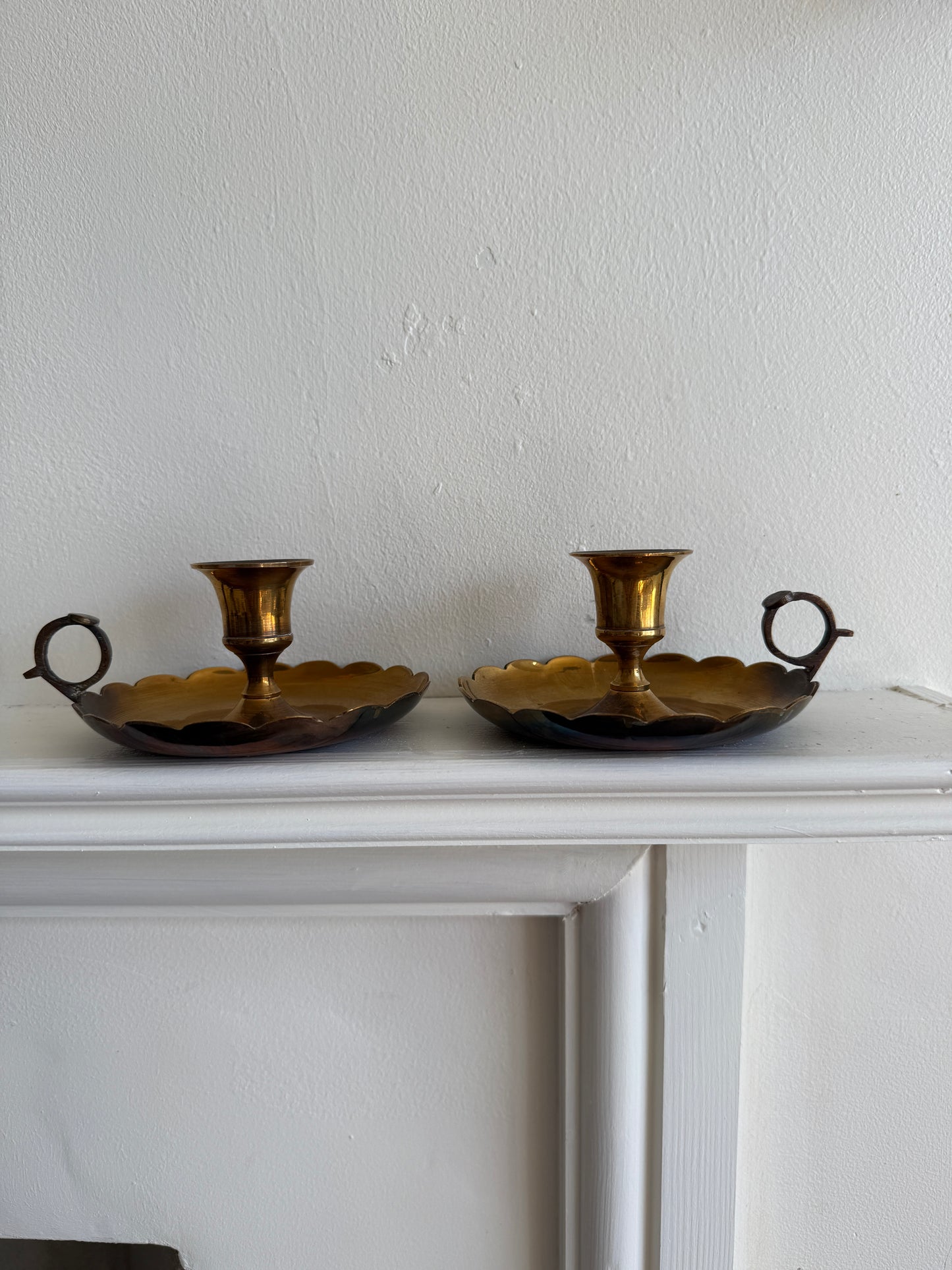 Pair of scalloped brass candlestick holders