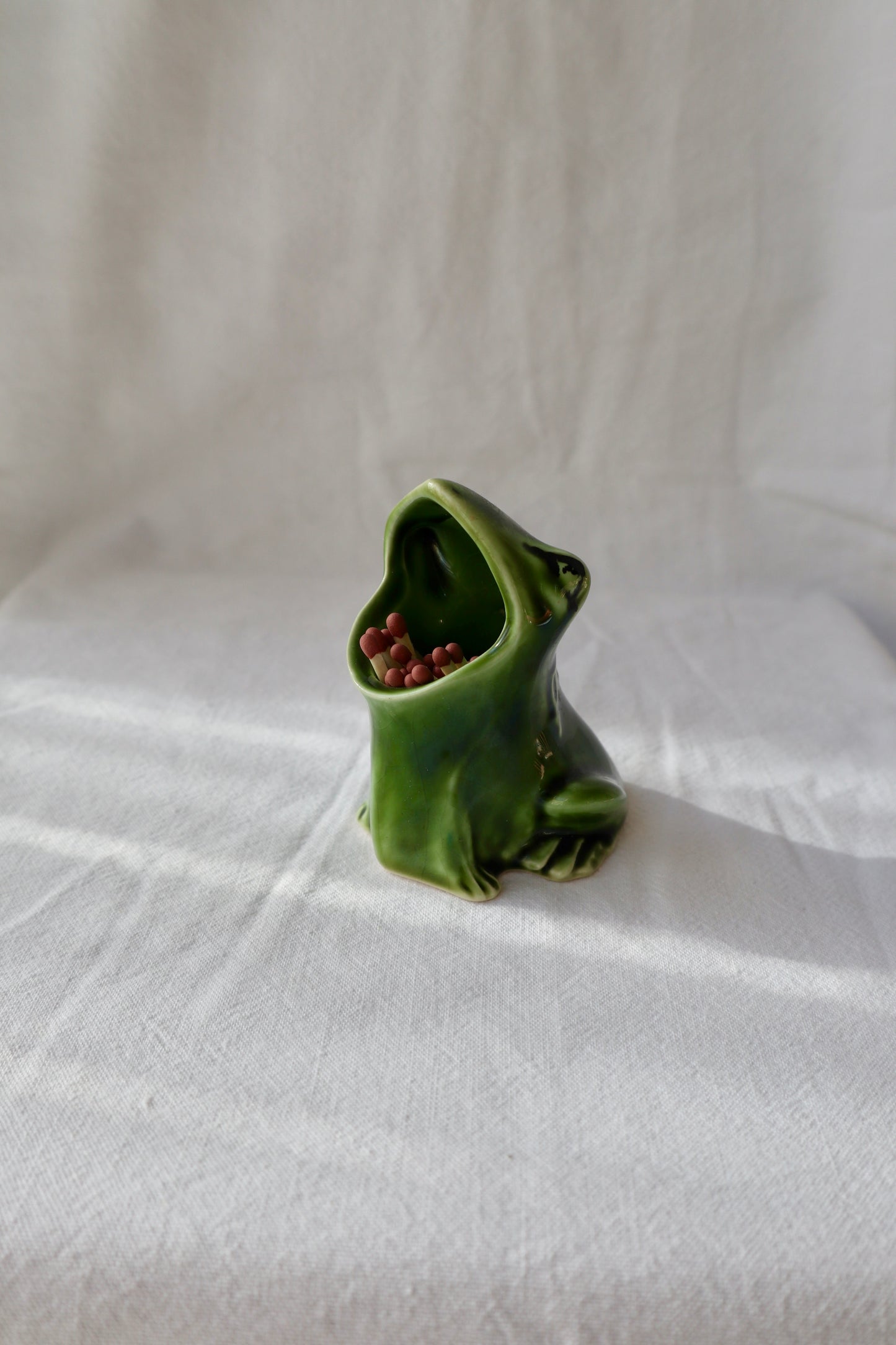 Perrier green ceramic frog matchstick or cocktail stick holder