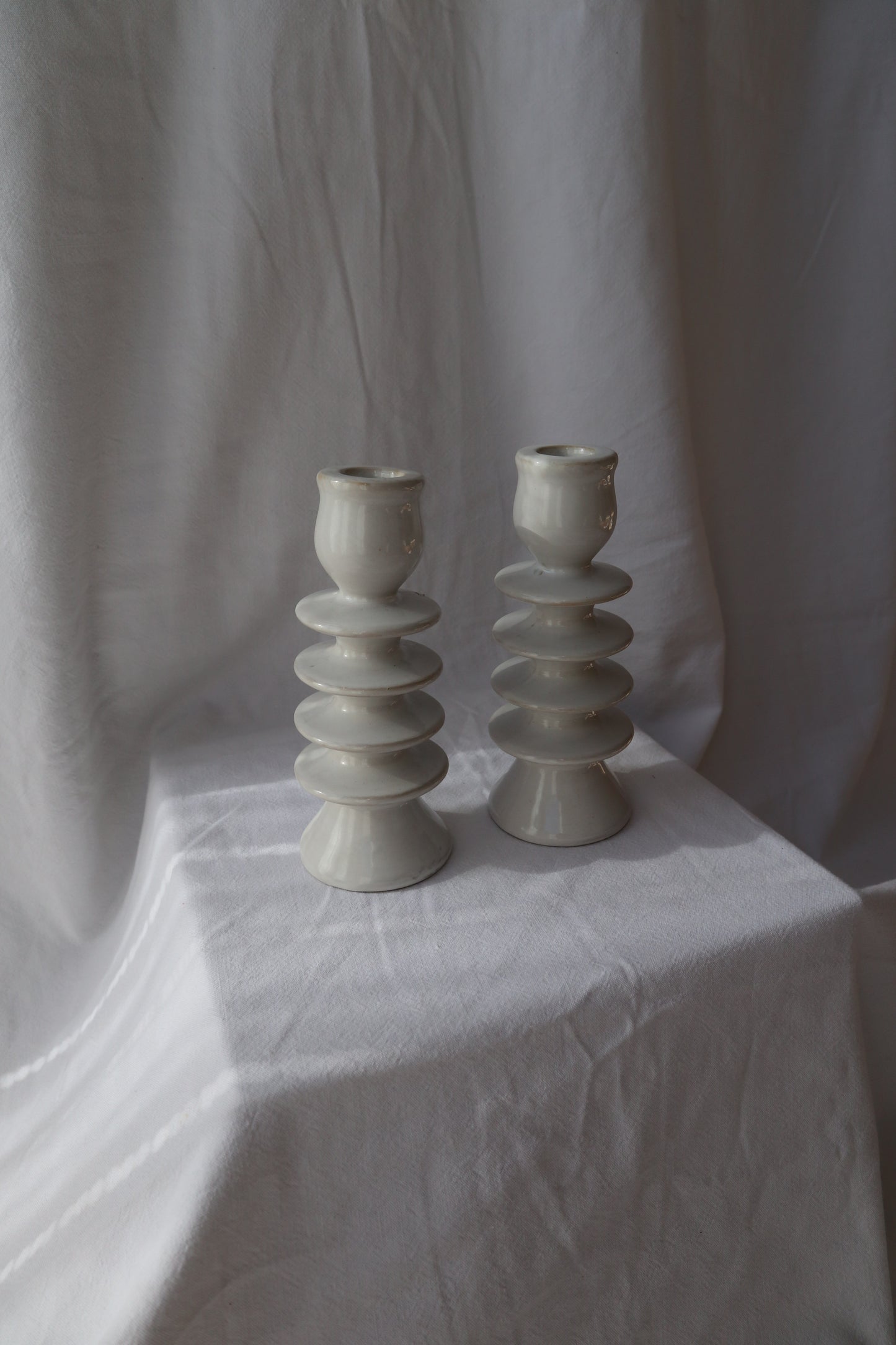 Pair of white ceramic hooped candleholders