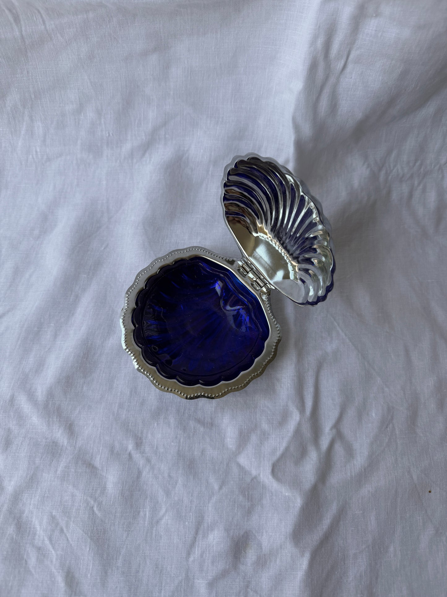 Silver plated shell caviar dish with cobalt blue glass insert