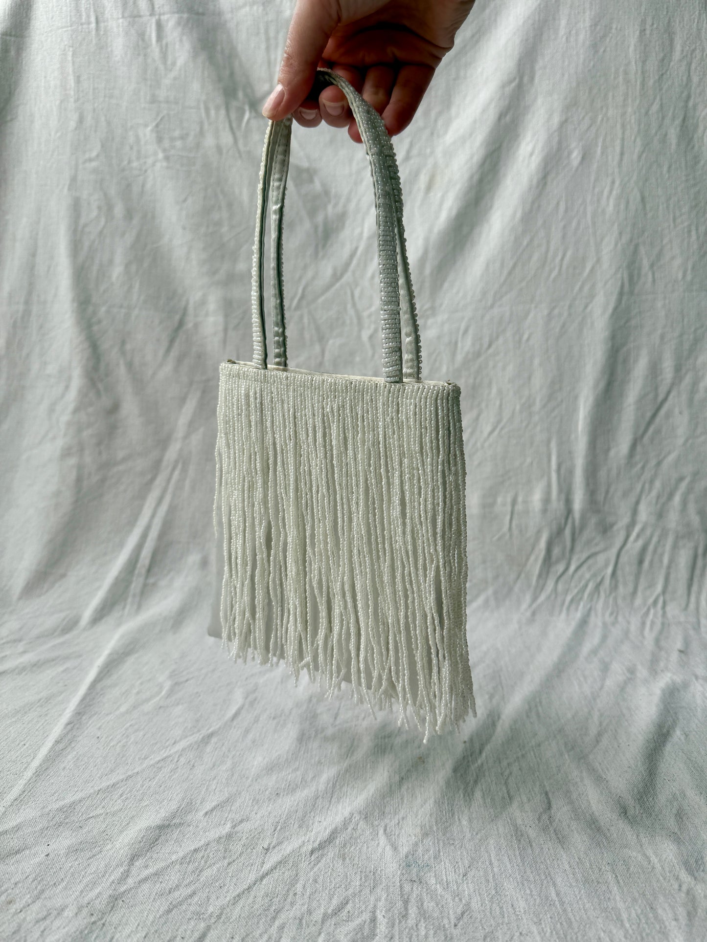 White beaded handbag