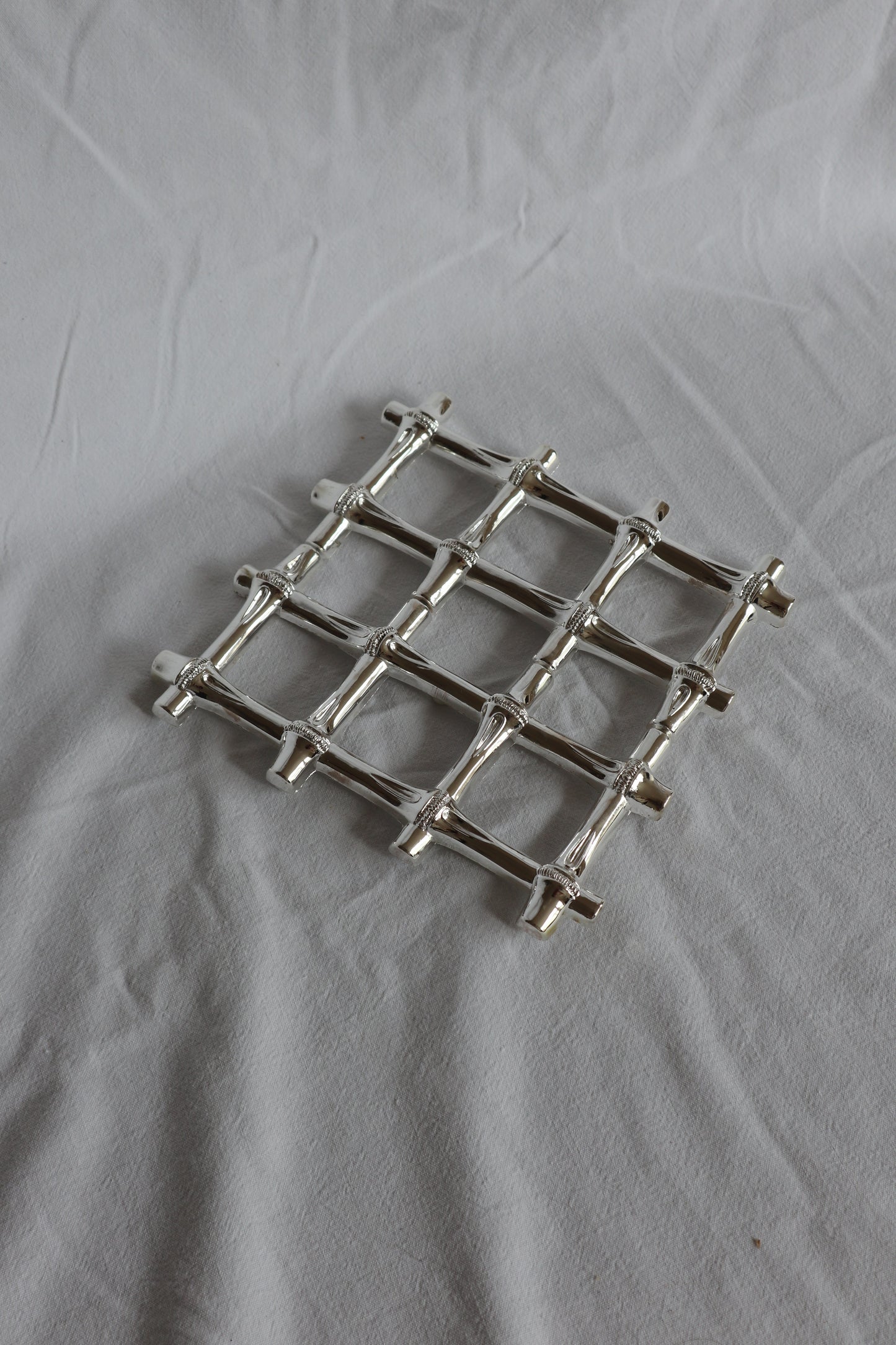 Expanding vintage silver faux bamboo trivet
