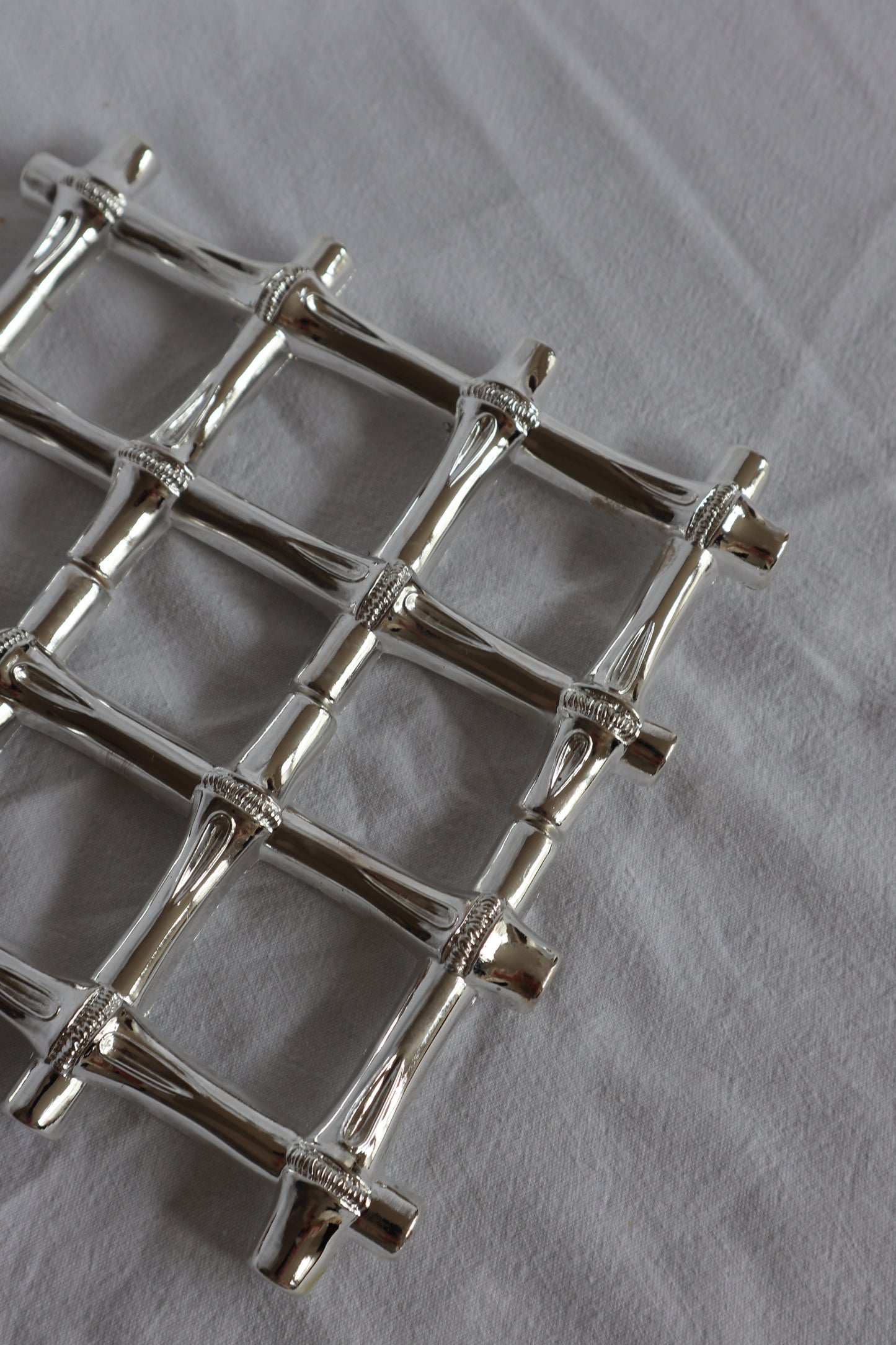 Expanding vintage silver faux bamboo trivet