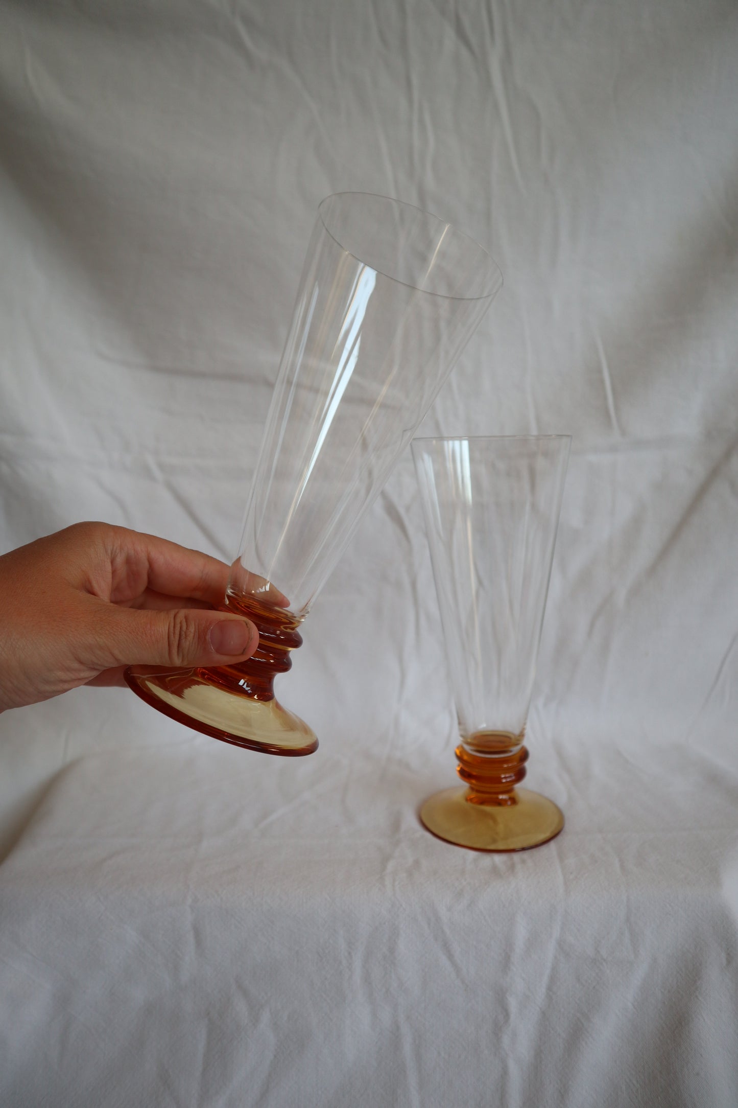 Set of 5 amber glass bobbin-stem mid century flutes