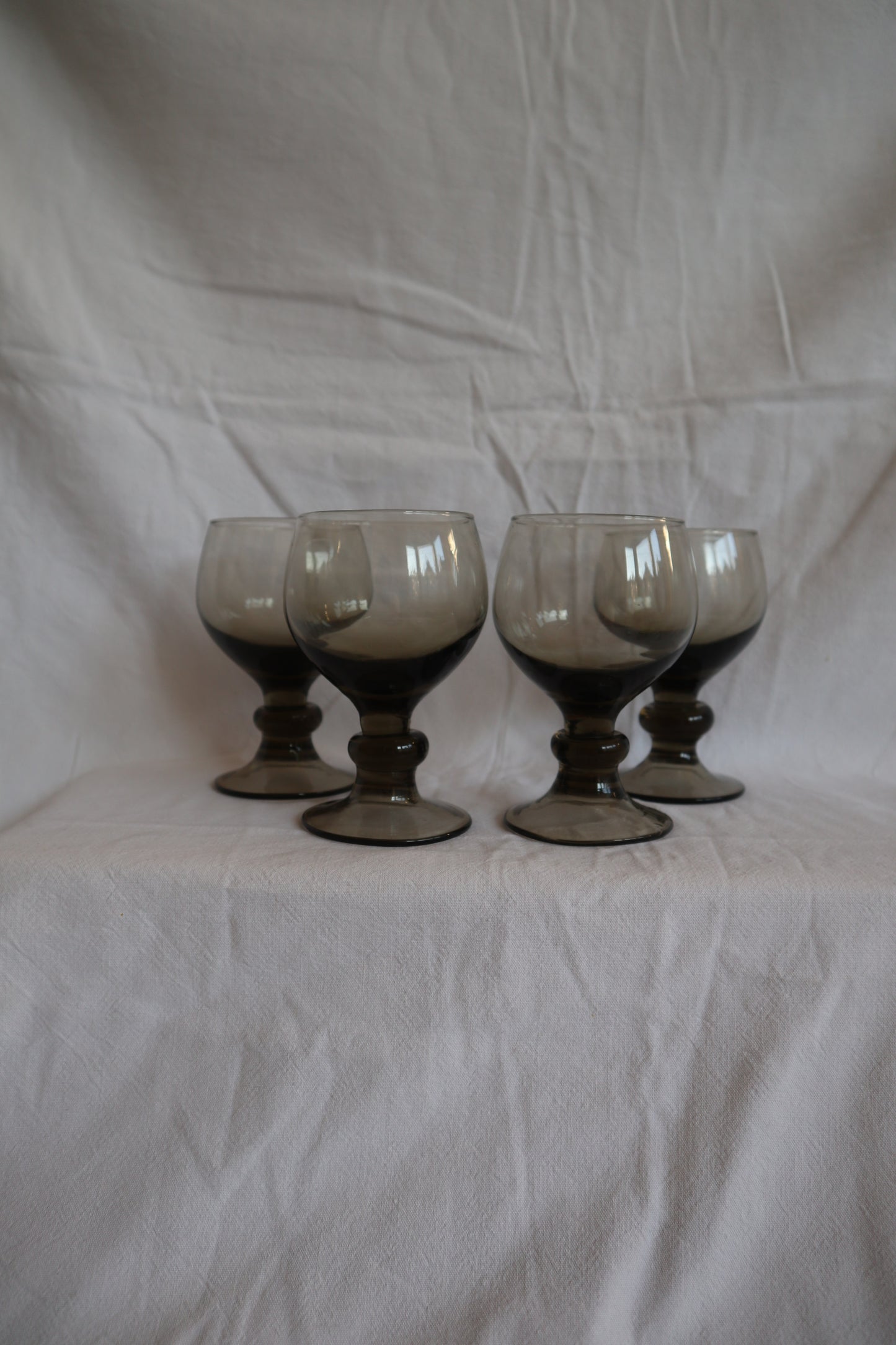 Set of 4 mid century smoked glass bobbin stem wine glasses