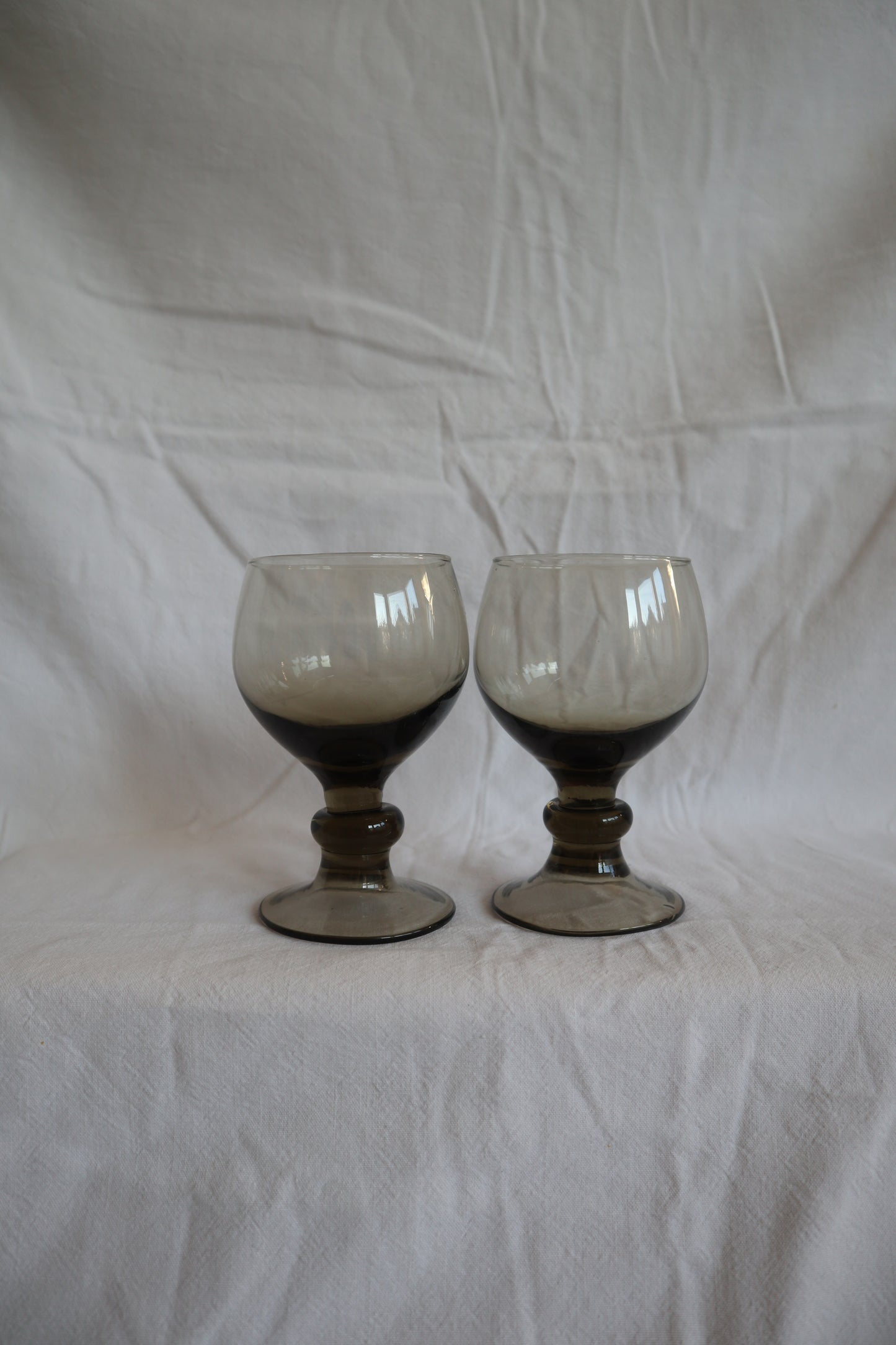 Set of 4 mid century smoked glass bobbin stem wine glasses